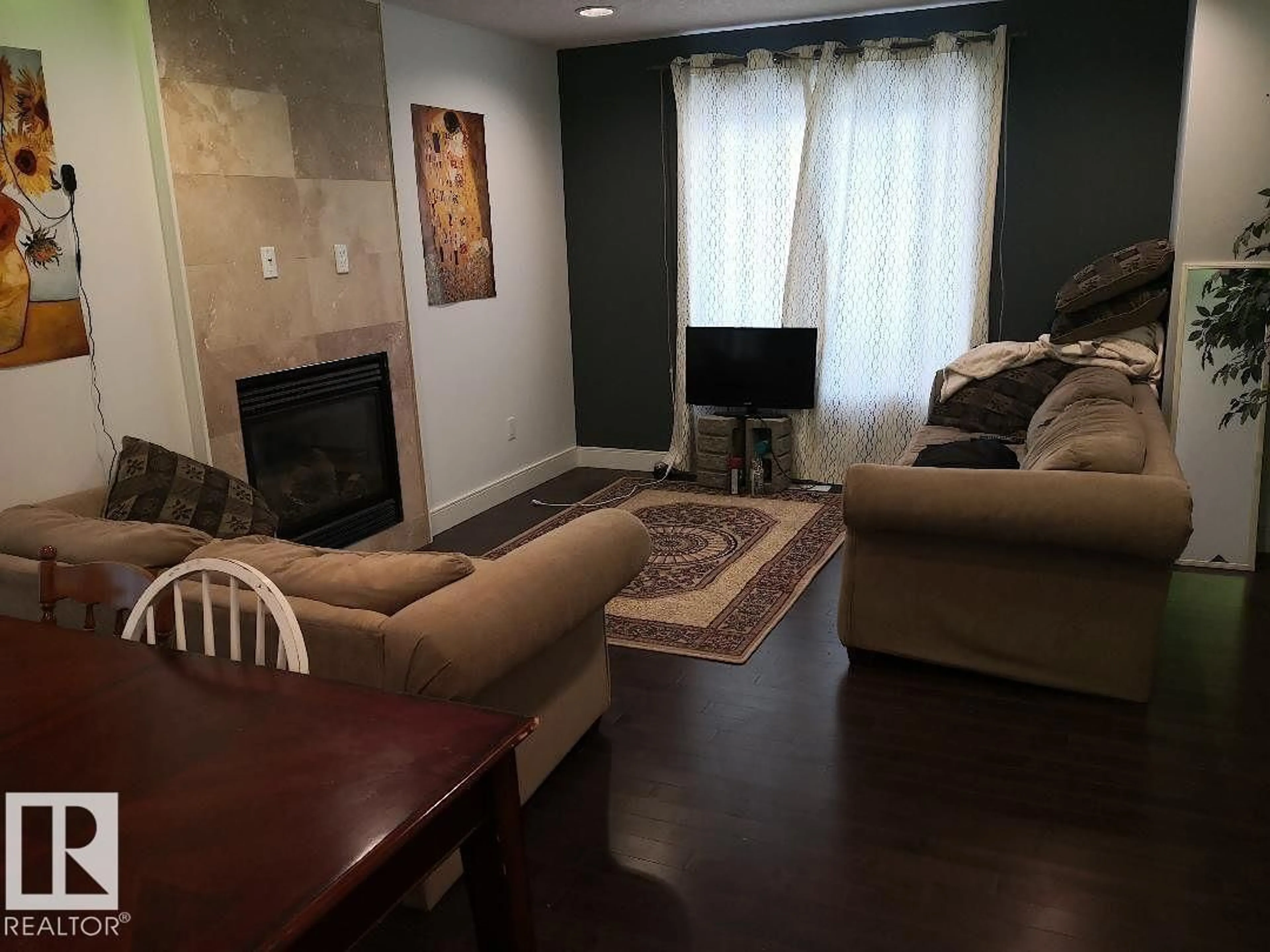 Living room with furniture, unknown for 10922 81 AV, Edmonton Alberta T6G0S2