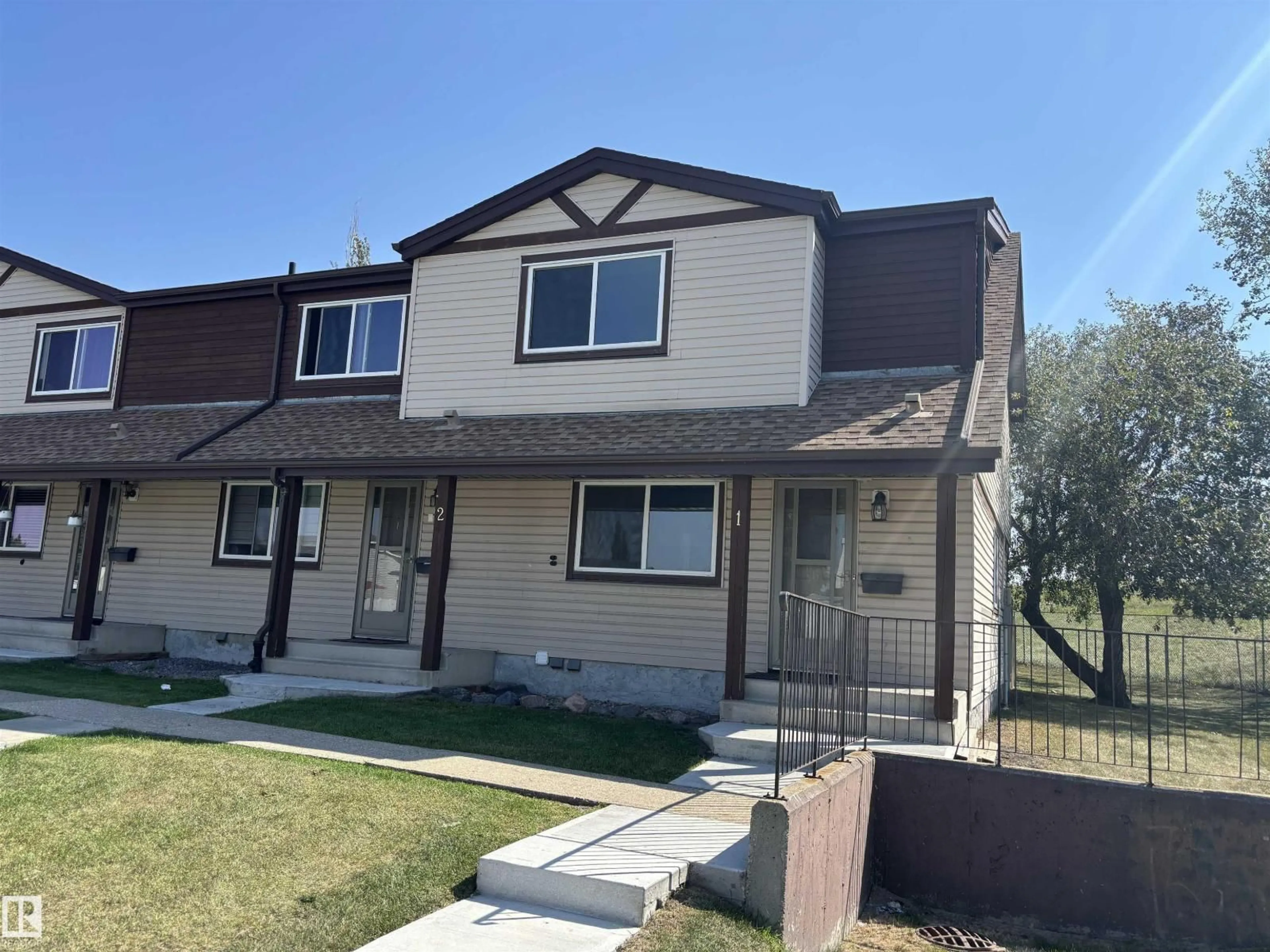 Home with vinyl exterior material, street for NW - 13833 30 ST, Edmonton Alberta T5Y2B2