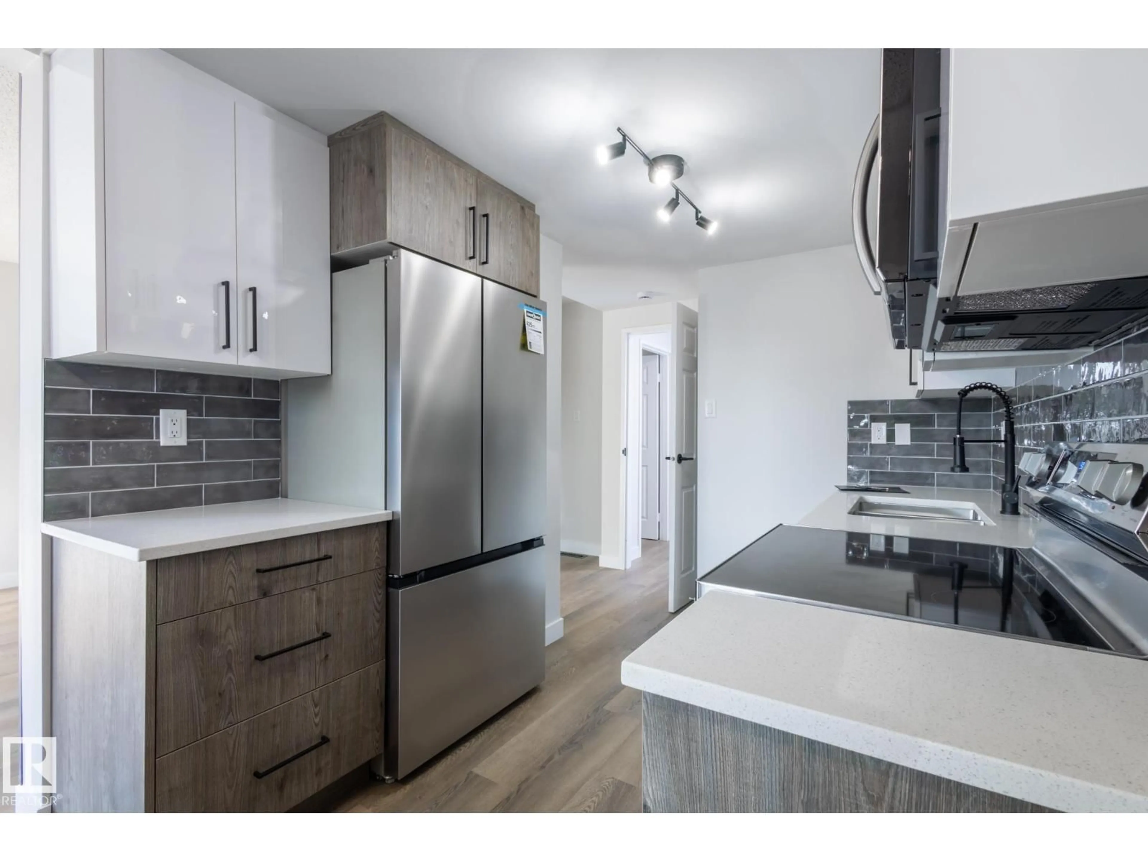 Open concept kitchen, wood/laminate floor for 62 AMBERLY CO, Edmonton Alberta T5A0H9