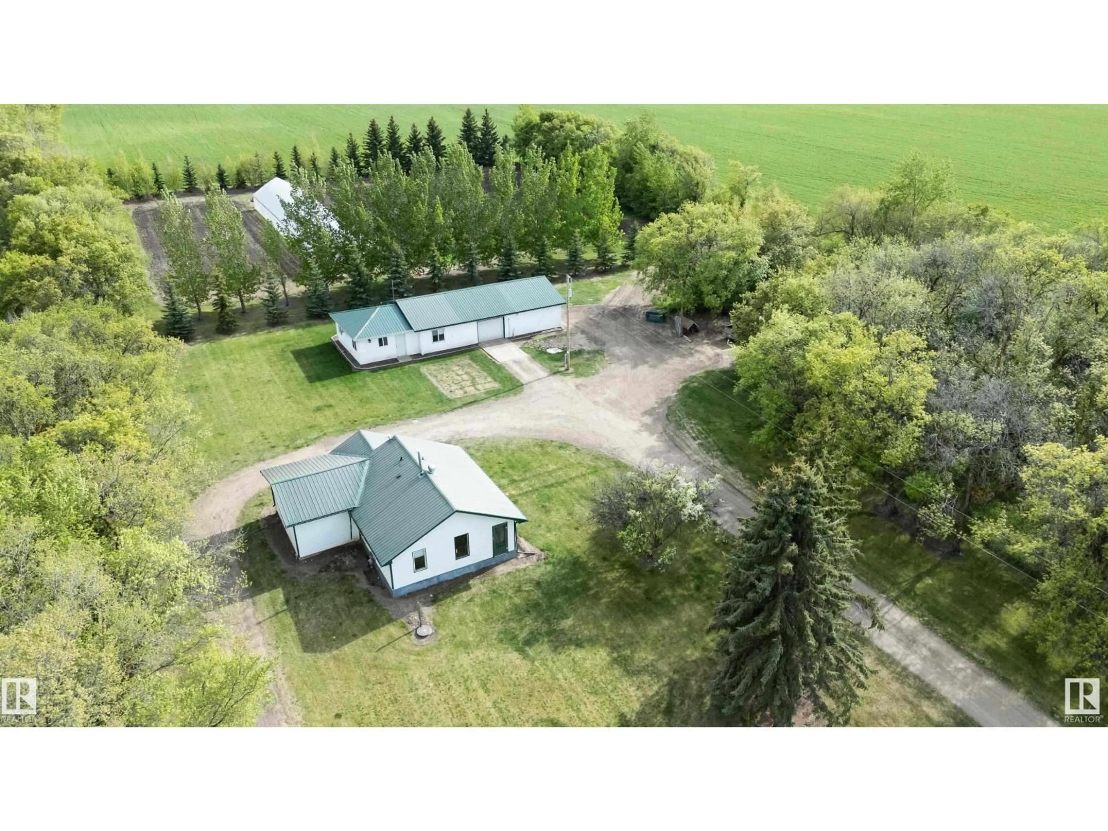 A pic from outside/outdoor area/front of a property/back of a property/a pic from drone, building for 1017 TWP RD 602, Rural Westlock County Alberta T7P2N4