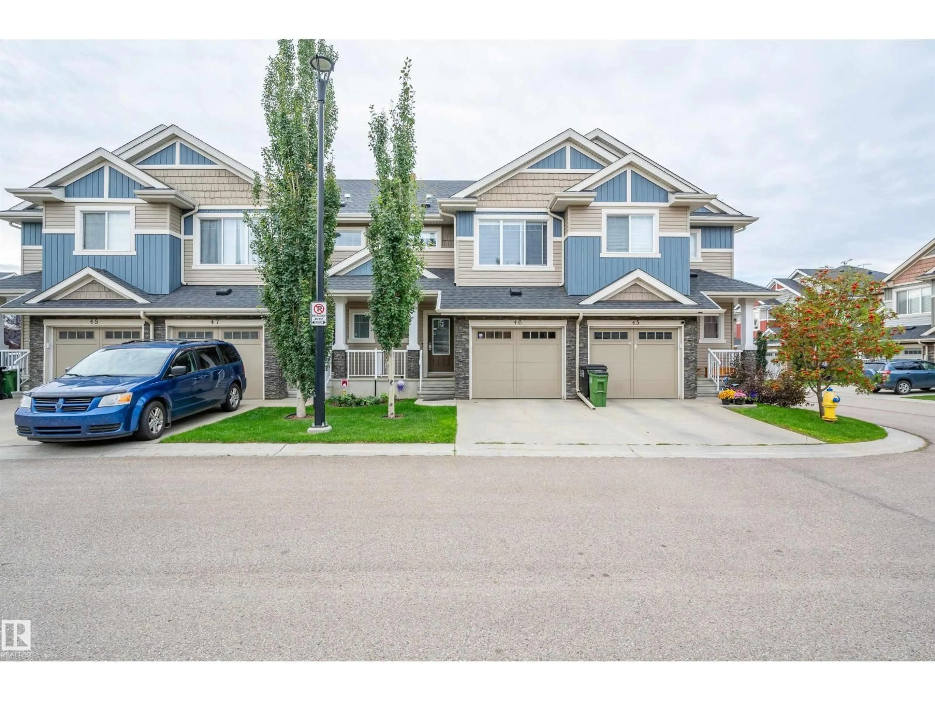 A pic from outside/outdoor area/front of a property/back of a property/a pic from drone, street for 2004 - 46 TRUMPETER WY, Edmonton Alberta T5S0J9