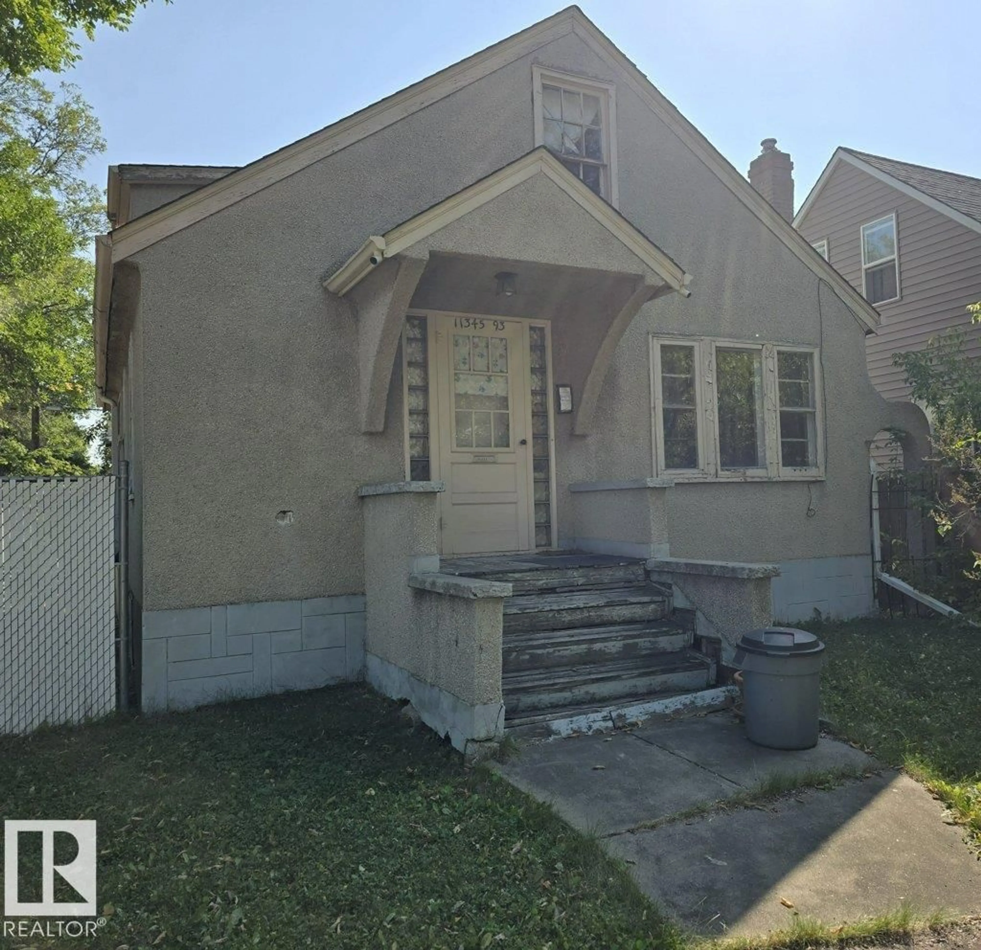 Home with vinyl exterior material, street for 11345 93 ST, Edmonton Alberta T5G1C3