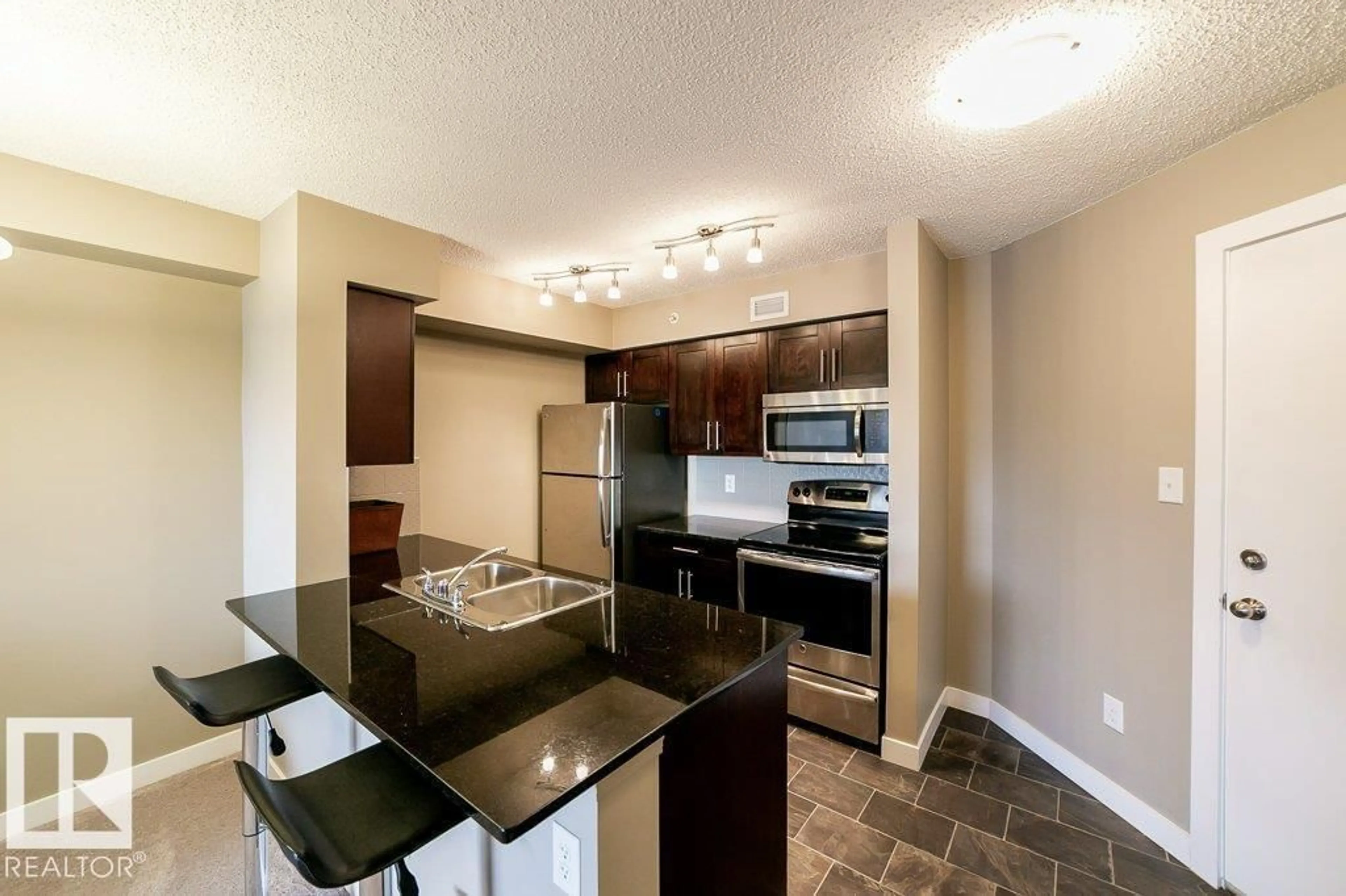 Open concept kitchen, unknown for #410 - 270 MCCONACHIE DR, Edmonton Alberta T5Y3N4