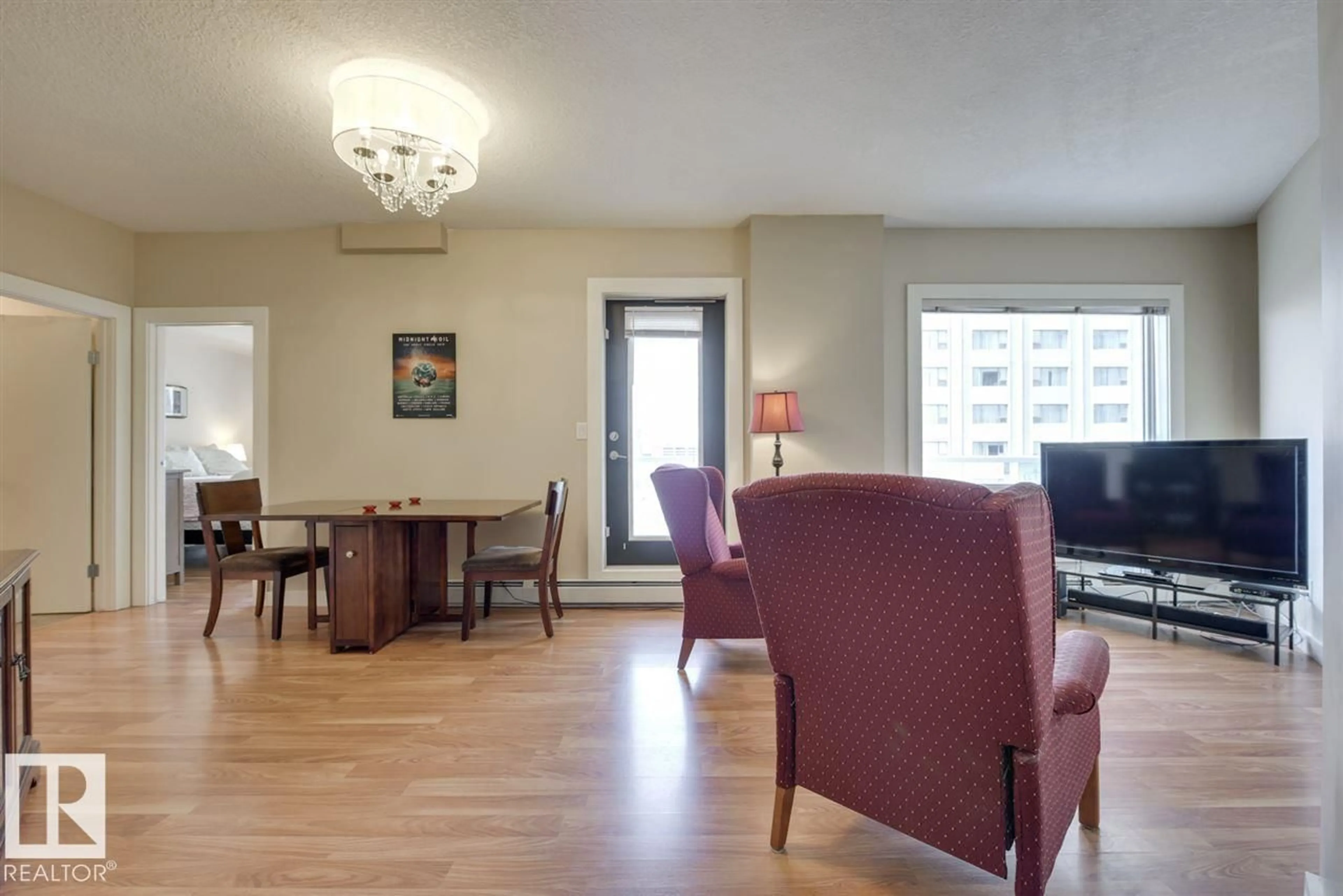Living room with furniture, wood/laminate floor for 10136 - 906 104 ST, Edmonton Alberta T5J0B5