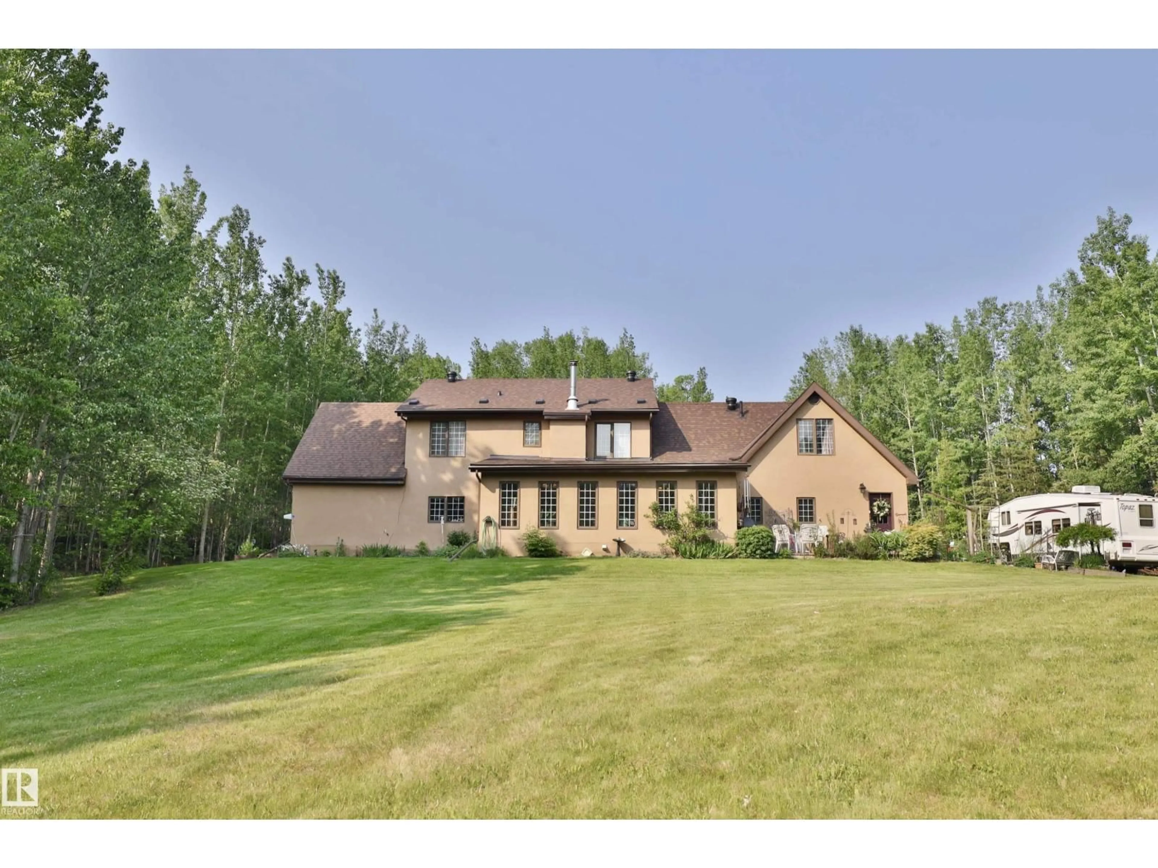 A pic from outside/outdoor area/front of a property/back of a property/a pic from drone, mountain view for 8002 45 ST, Rural Wetaskiwin County Alberta T0C2C0