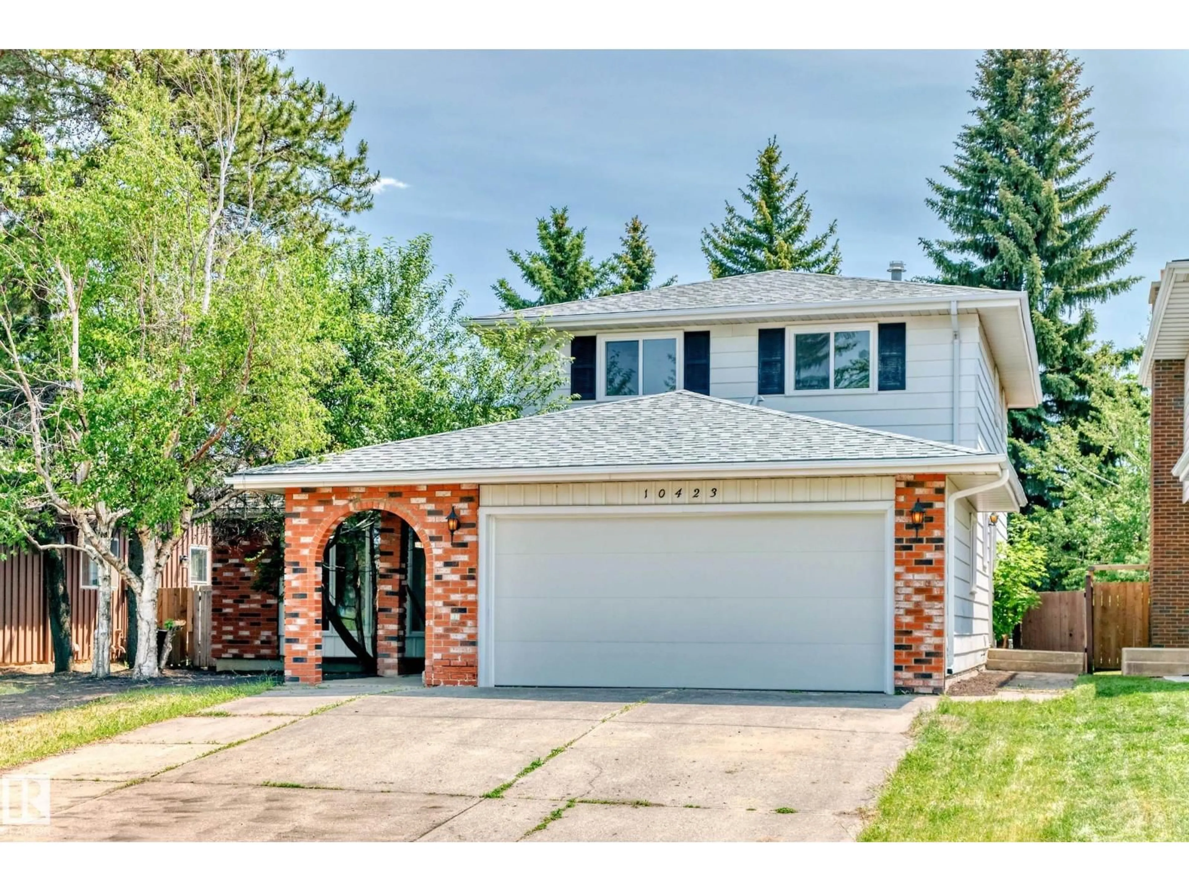Home with vinyl exterior material, street for NW - 10423 35 AV, Edmonton Alberta T6J2M8