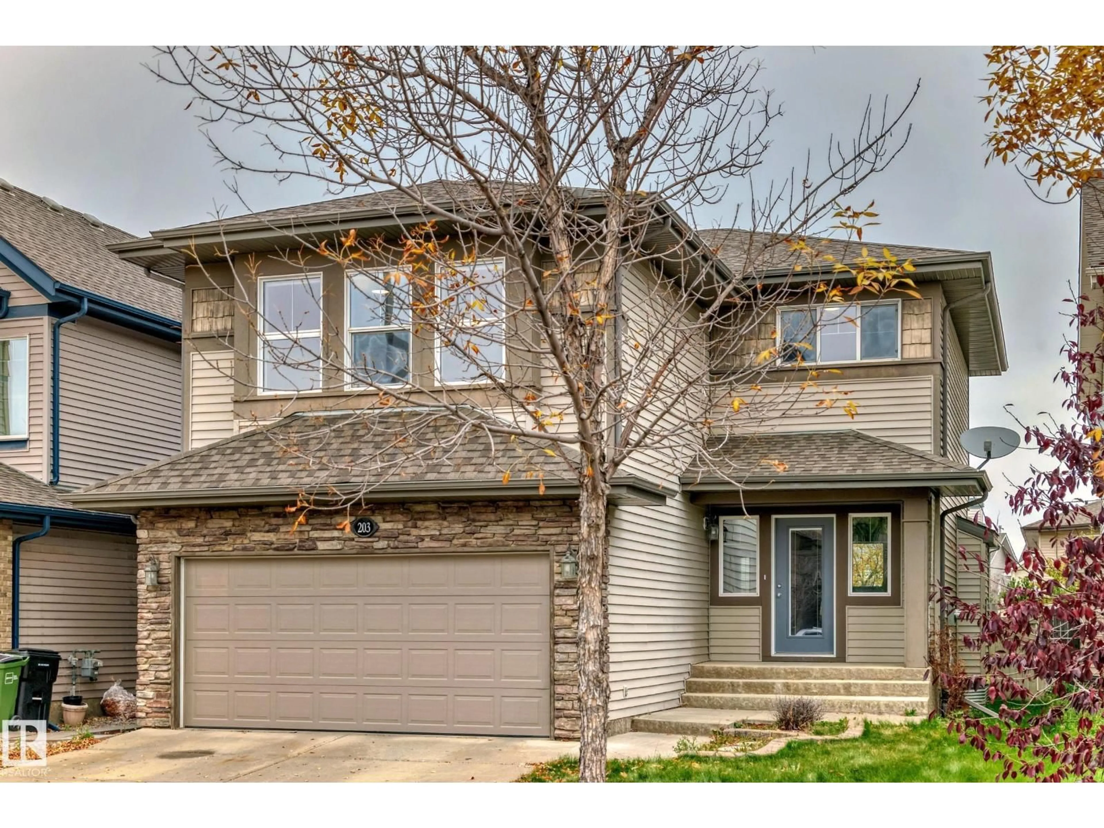 Home with vinyl exterior material, street for 203 CALDWELL WY, Edmonton Alberta T6M2X2