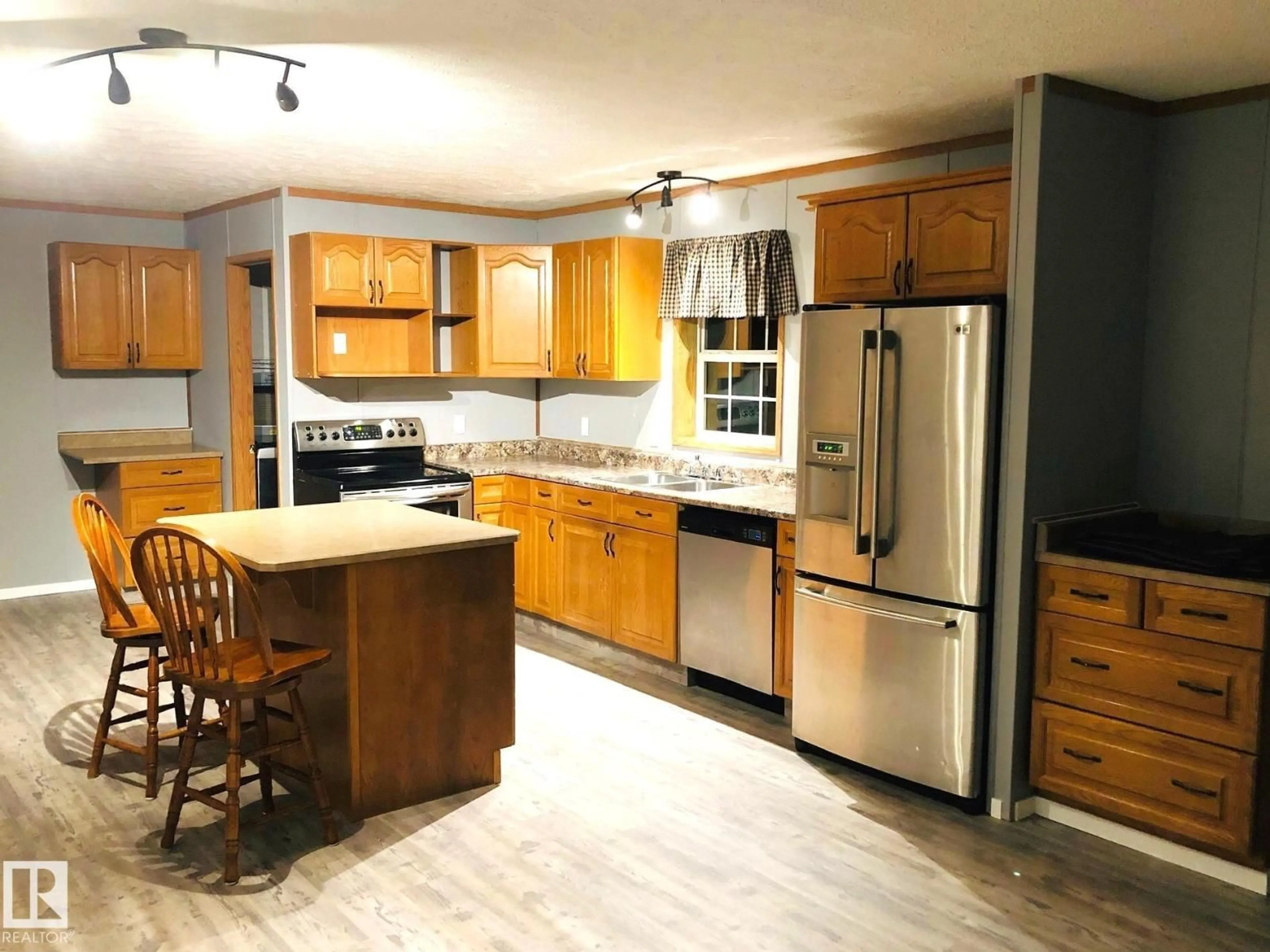 Open concept kitchen, wood/laminate floor for 48041 RGE ROAD 264, Rural Leduc County Alberta T0C0V0