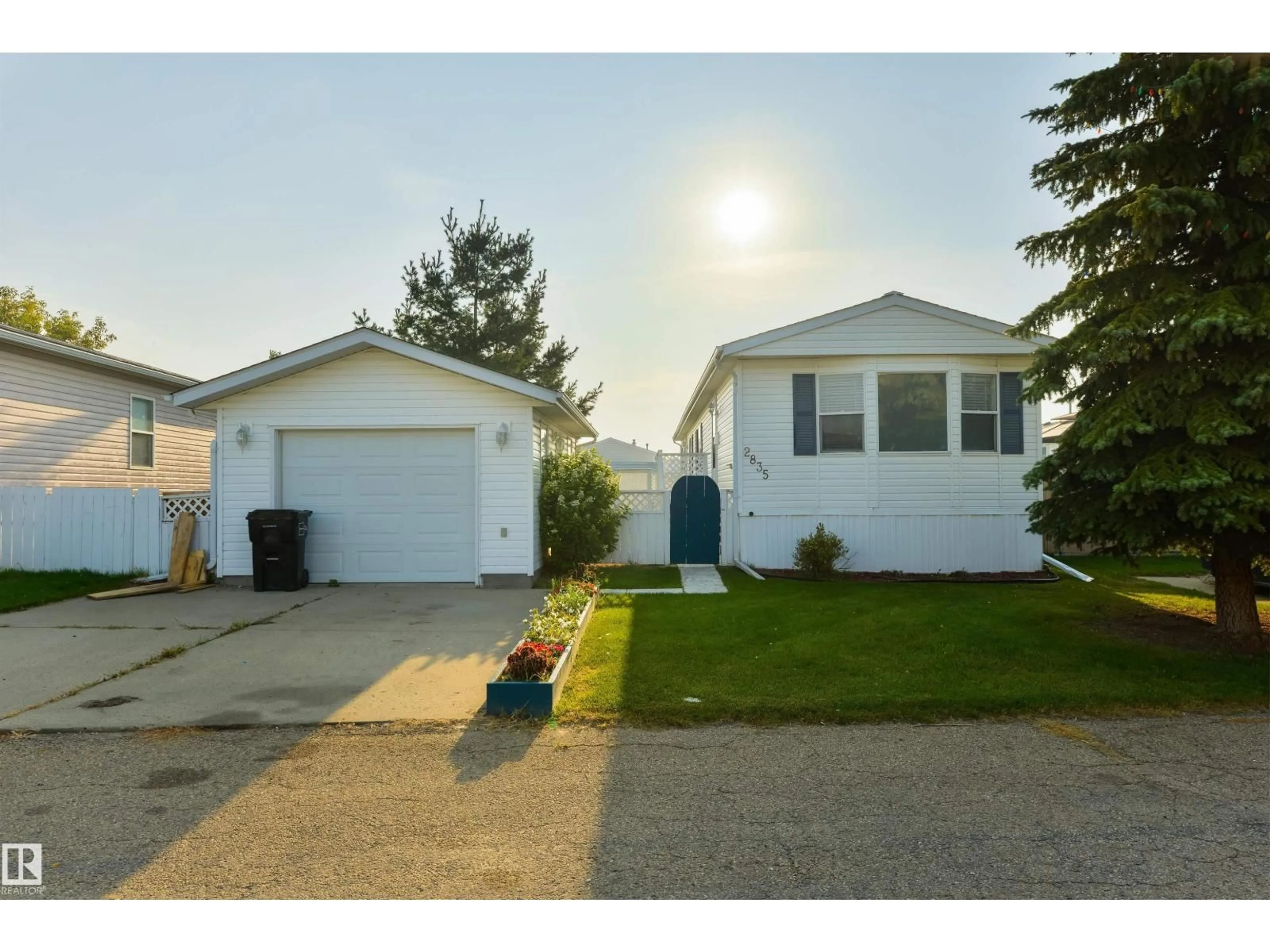 Home with vinyl exterior material, street for 2835 LAKESIDE CL, Edmonton Alberta T5S1T7