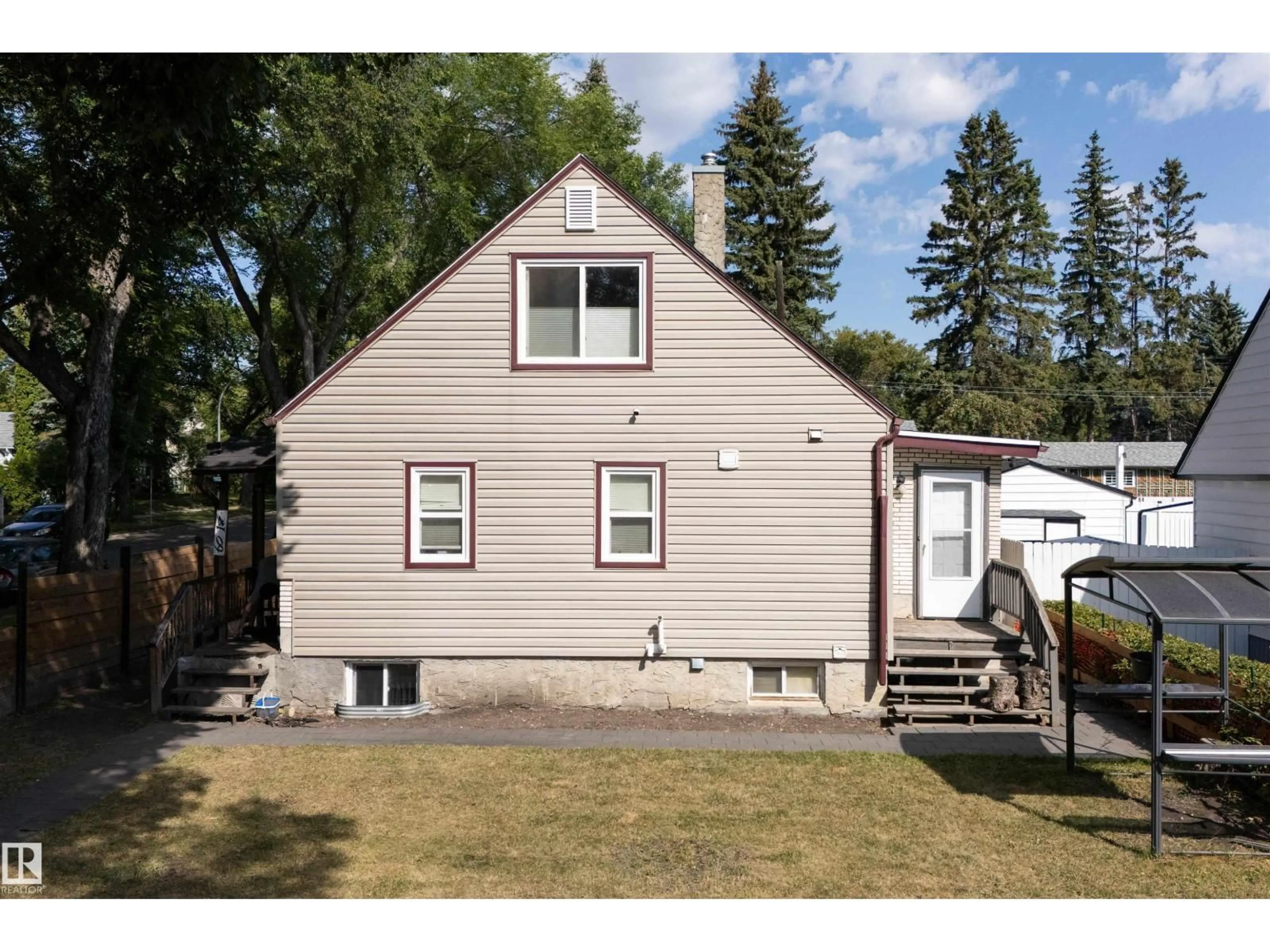 Home with vinyl exterior material, street for NW - 6014 120 AV, Edmonton Alberta T5W1L7