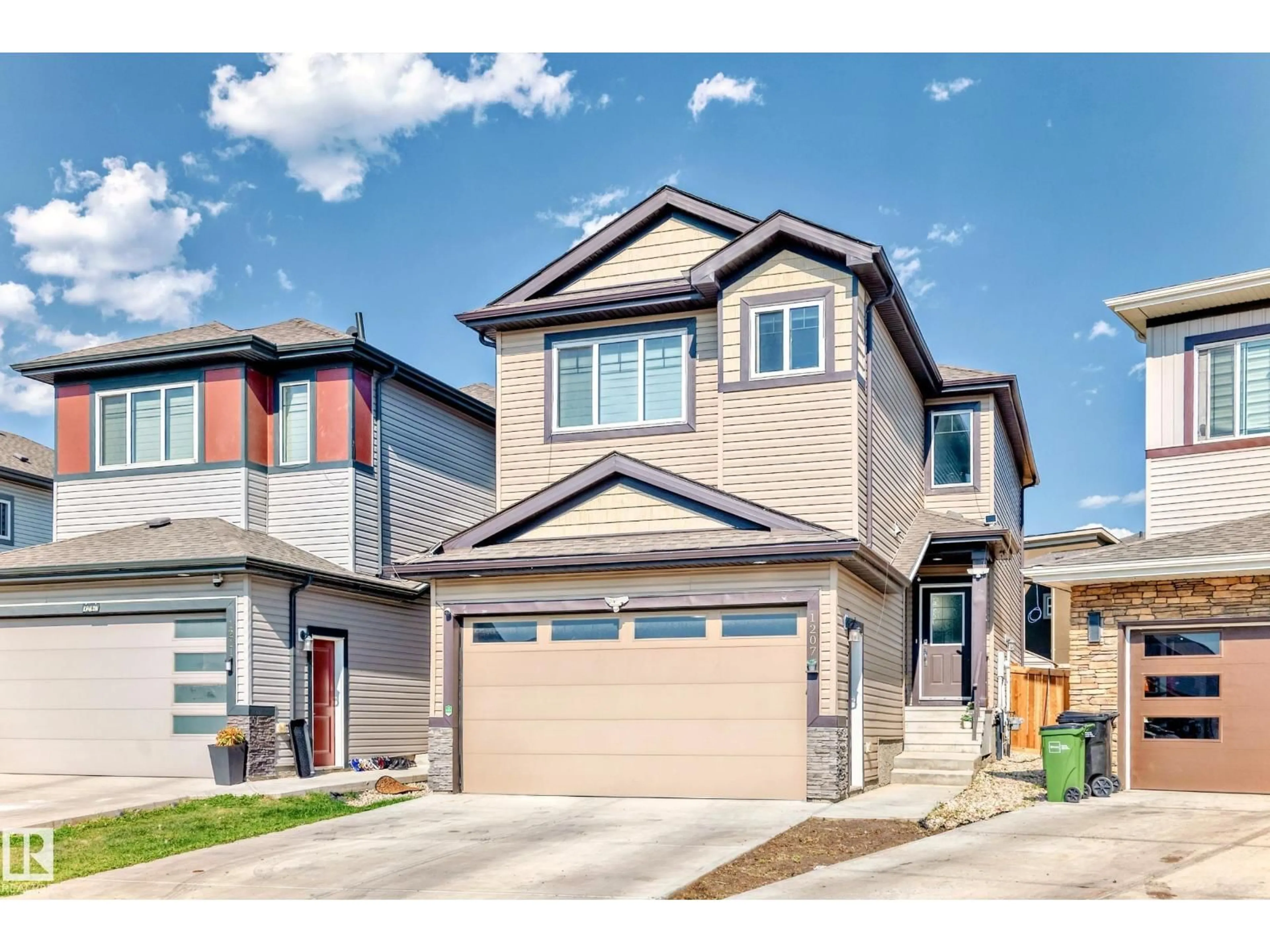 Home with vinyl exterior material, street for NW - 1207 24 ST, Edmonton Alberta T6T2M7