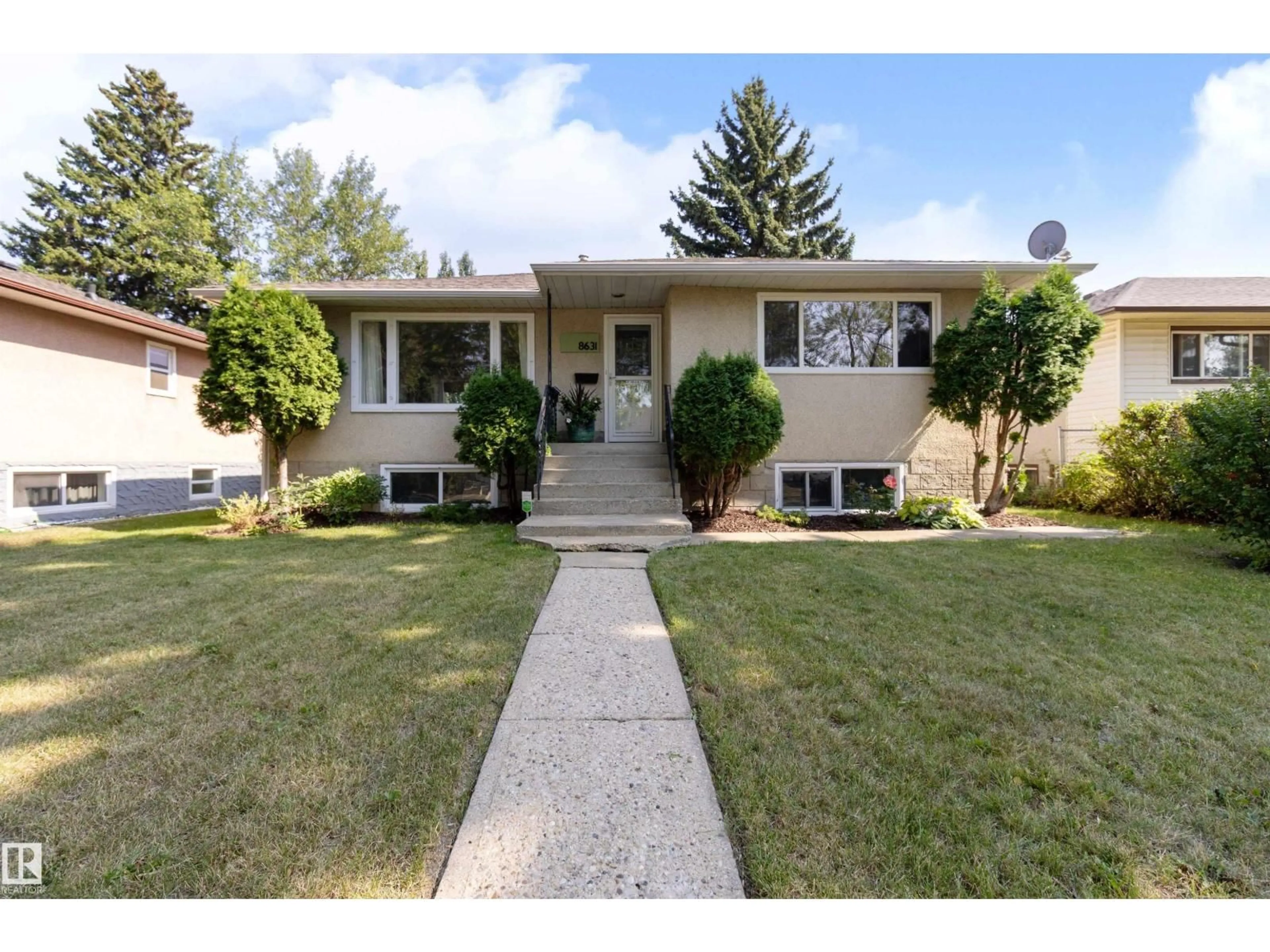 Home with vinyl exterior material, street for 8631 76 ST, Edmonton Alberta T6C2K1