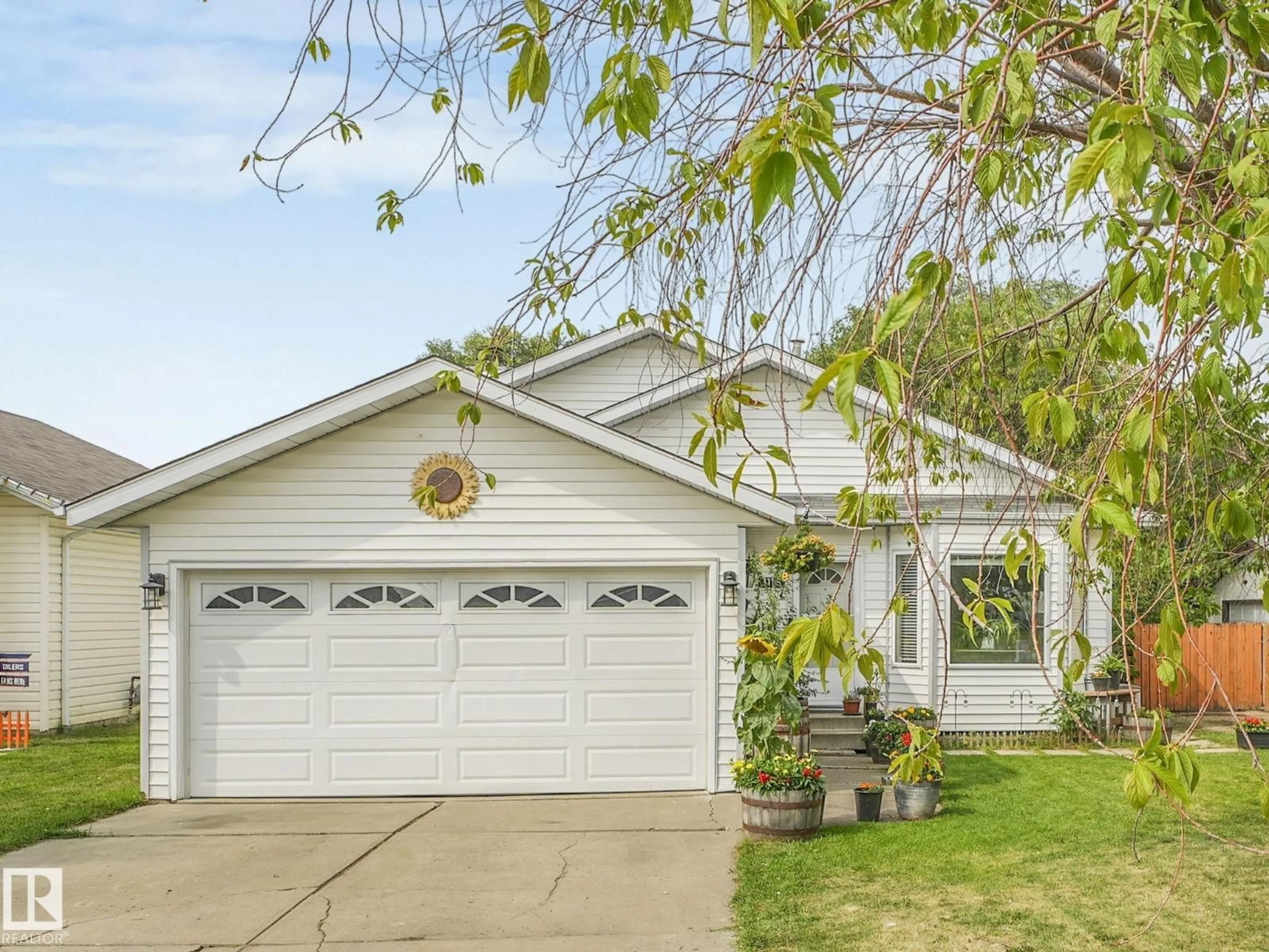 Home with vinyl exterior material, street for 1116 61 ST, Edmonton Alberta T6L3Z9