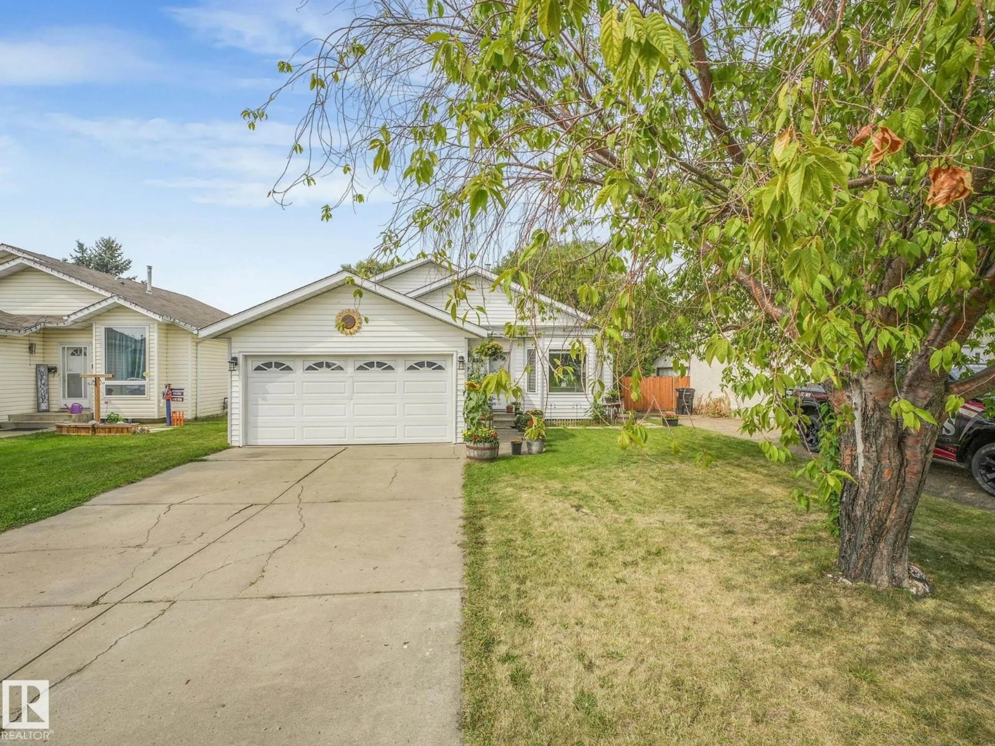 Home with vinyl exterior material, street for 1116 61 ST, Edmonton Alberta T6L3Z9