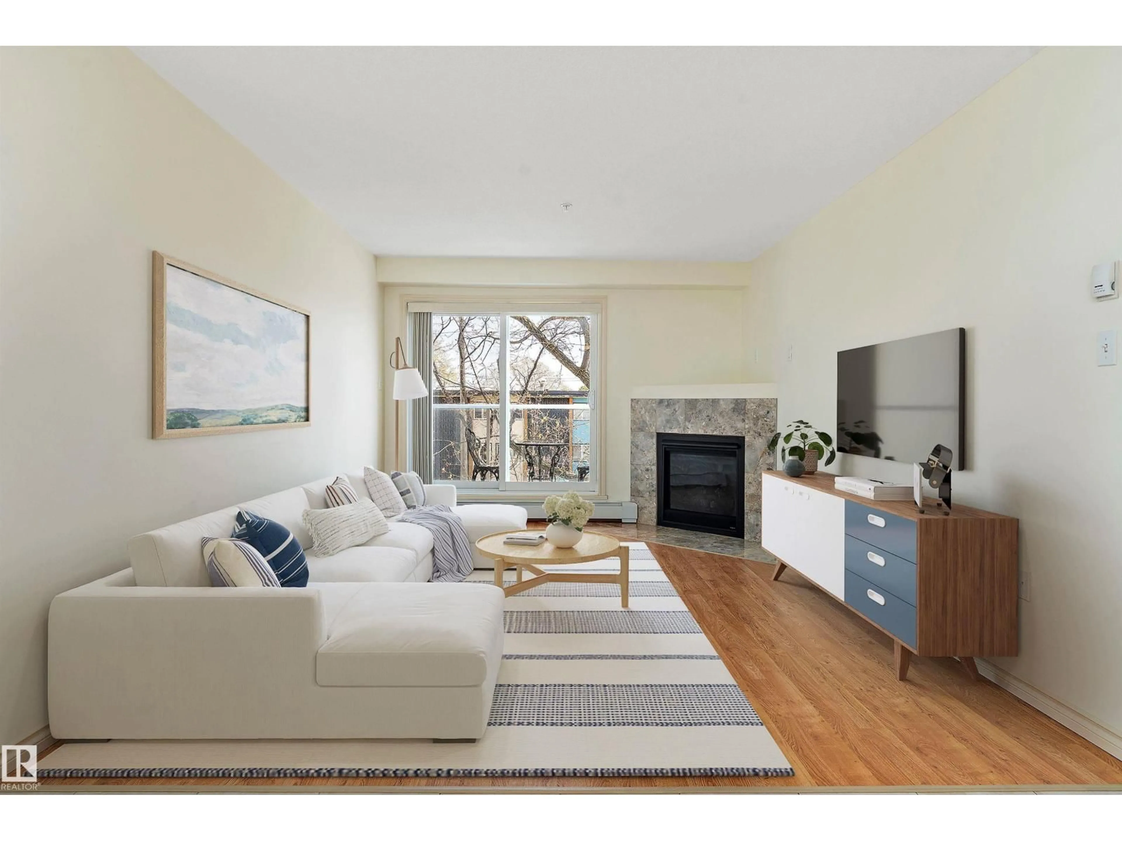 Living room with furniture, wood/laminate floor for #303 - 10710 116 ST, Edmonton Alberta T5H3M2