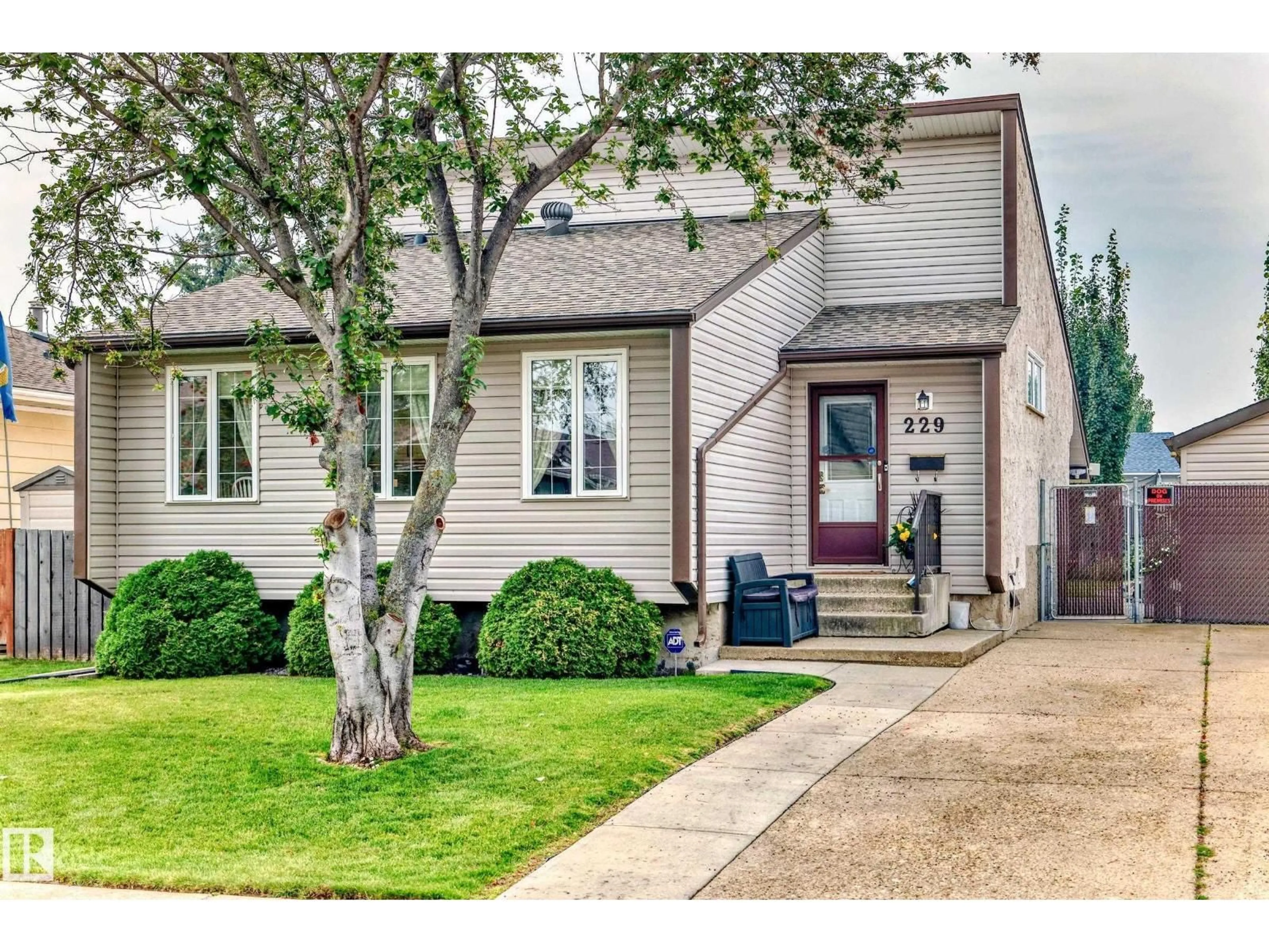 Home with vinyl exterior material, street for 229 WARWICK RD, Edmonton Alberta T5X4R1