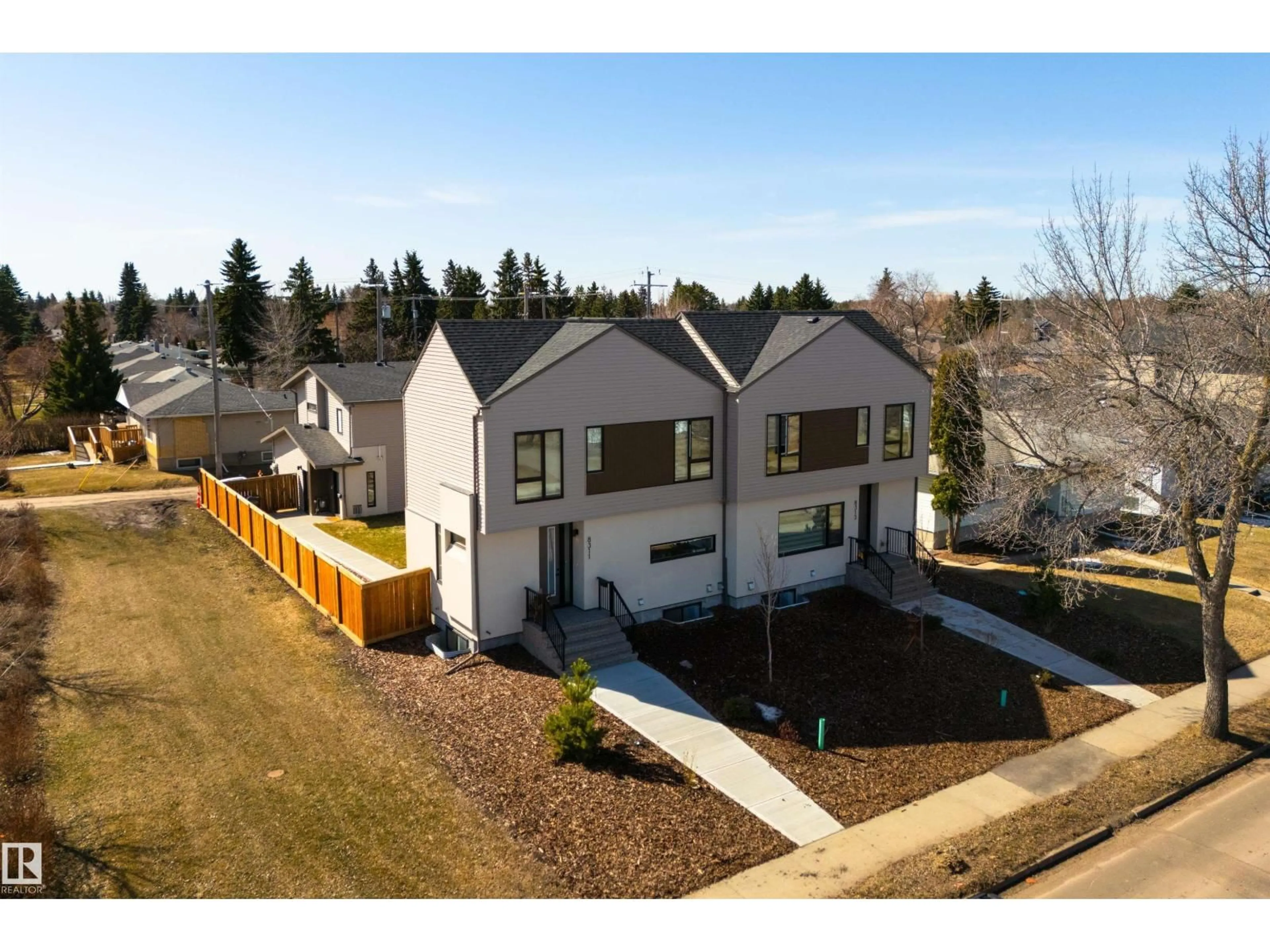 A pic from outside/outdoor area/front of a property/back of a property/a pic from drone, street for 8311 & 8313 76 AV, Edmonton Alberta T6C0H9