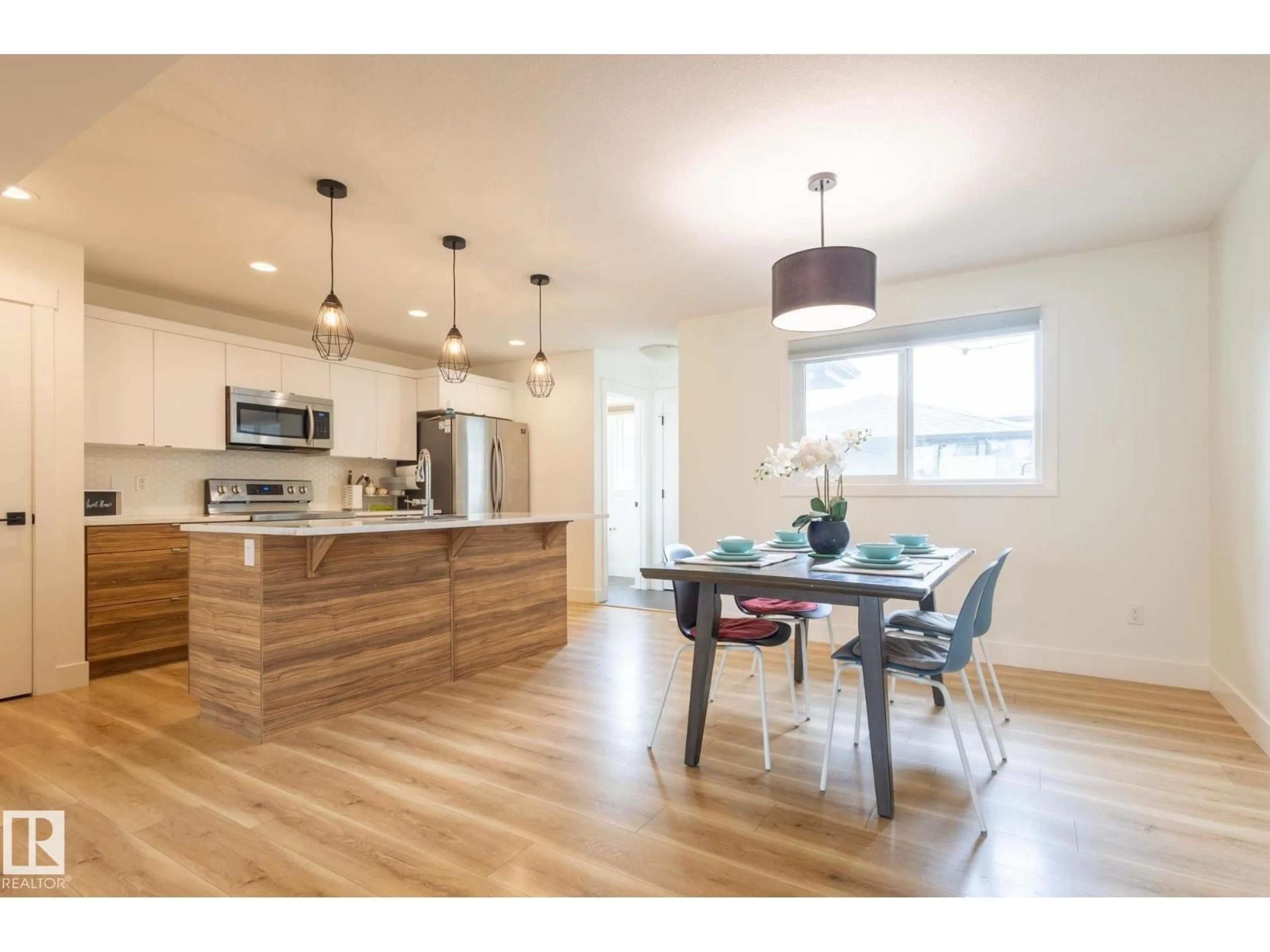 Open concept kitchen, wood/laminate floor for SW - 6481 KING WD, Edmonton Alberta T6W3Z9