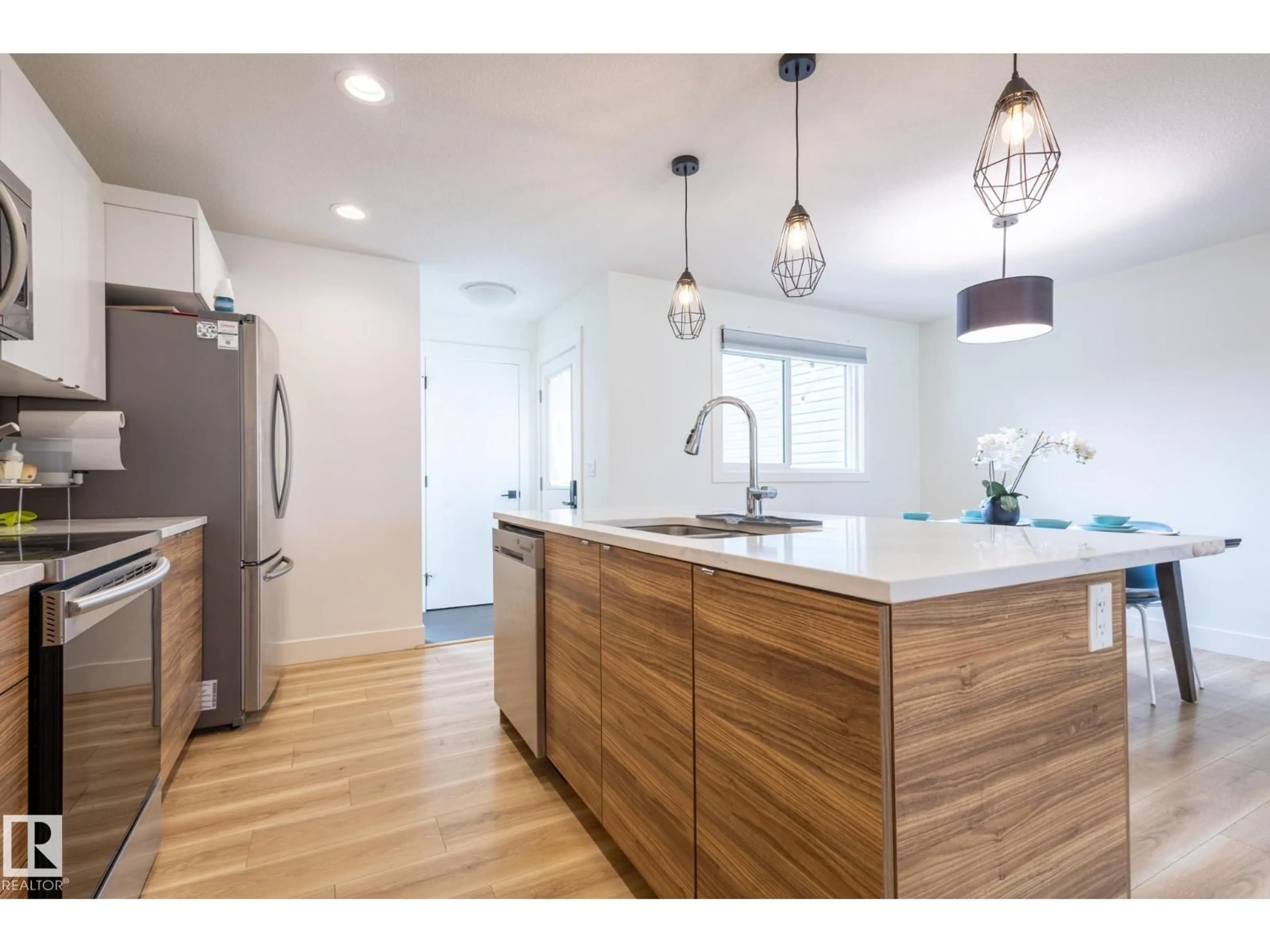 Open concept kitchen, wood/laminate floor for SW - 6481 KING WD, Edmonton Alberta T6W3Z9