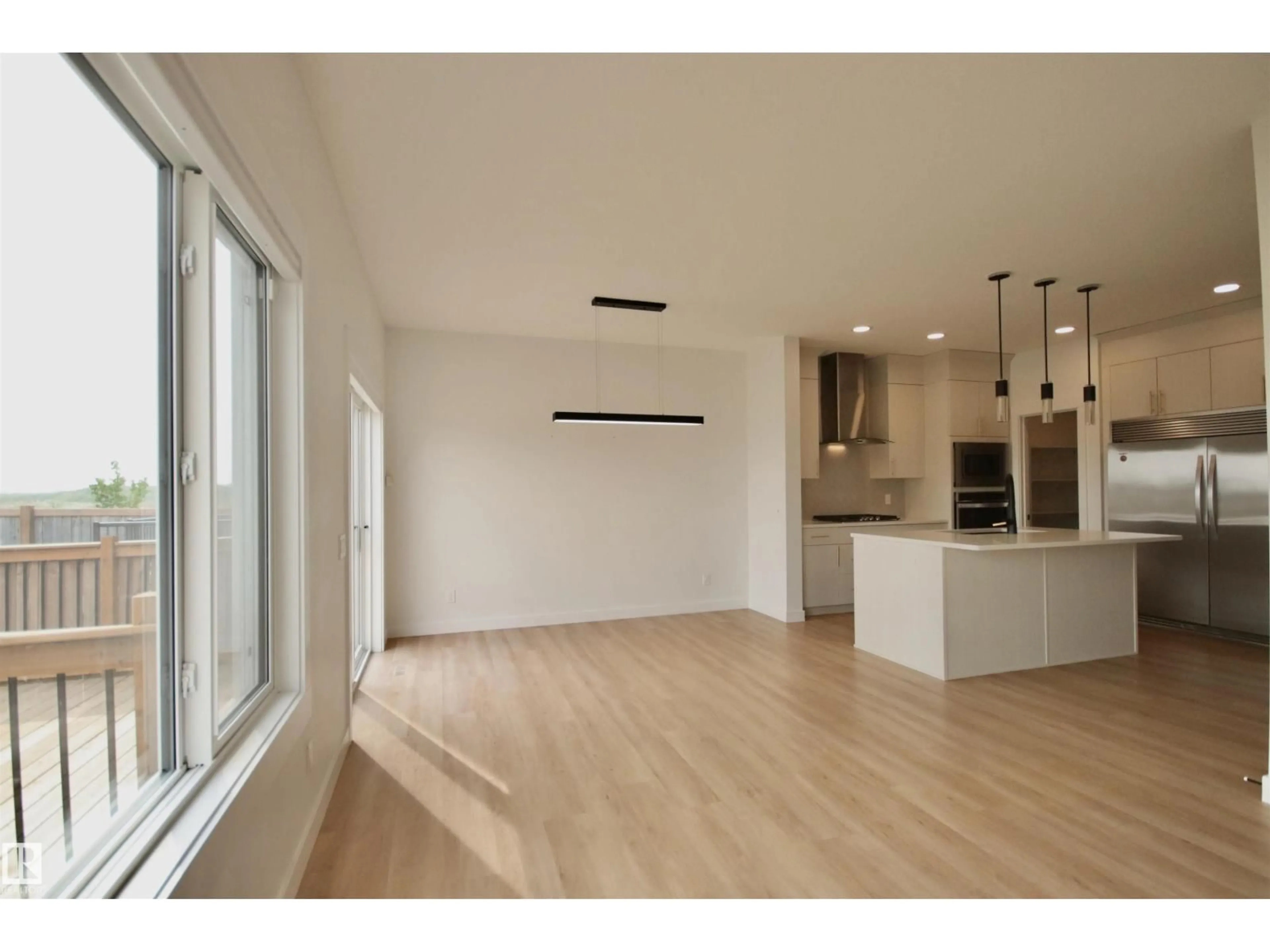 Open concept kitchen, wood/laminate floor for NW - 9981 205A ST, Edmonton Alberta T5T7N4