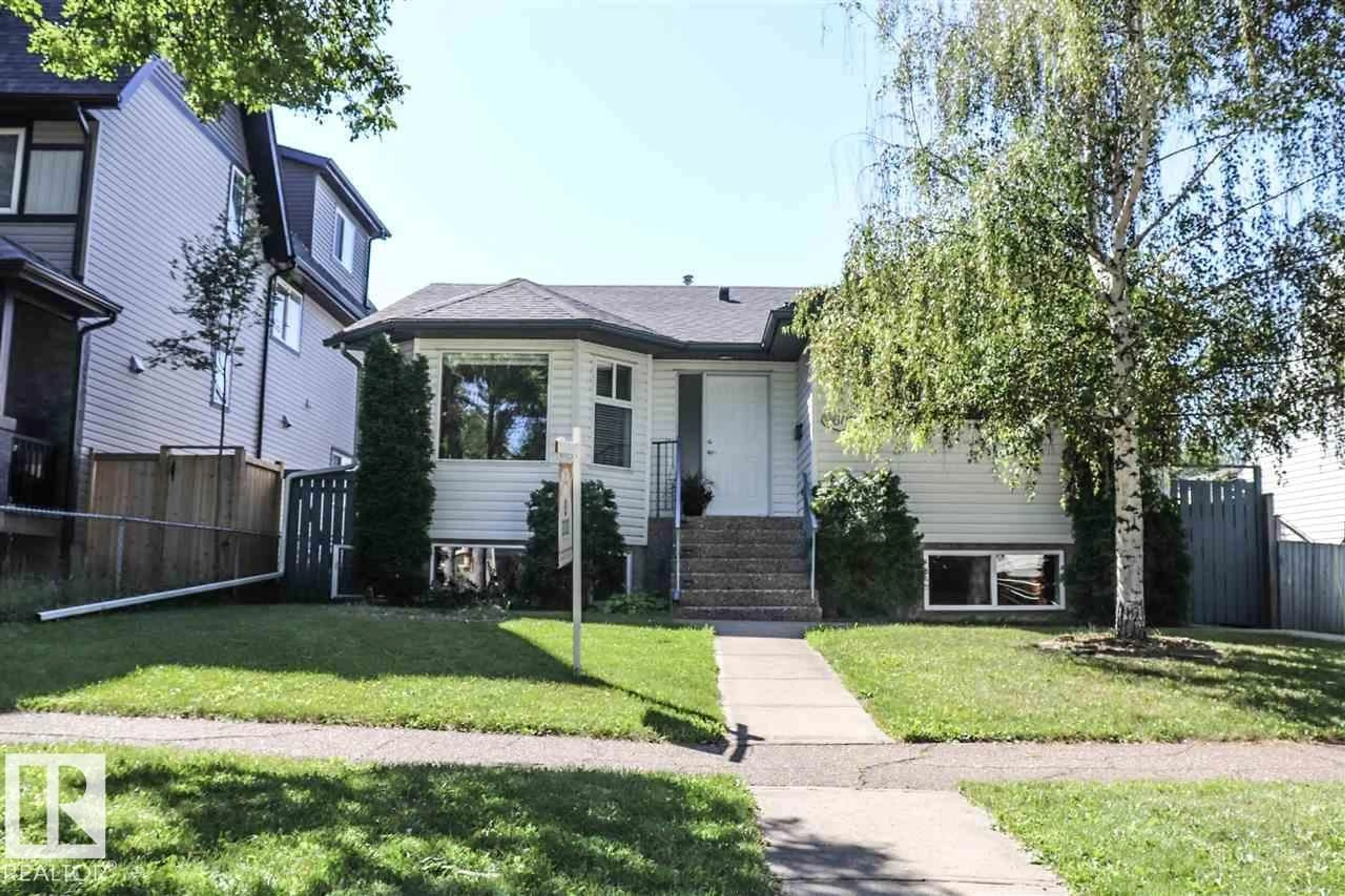 Home with vinyl exterior material, street for 9607 73 AV, Edmonton Alberta T6E1B3