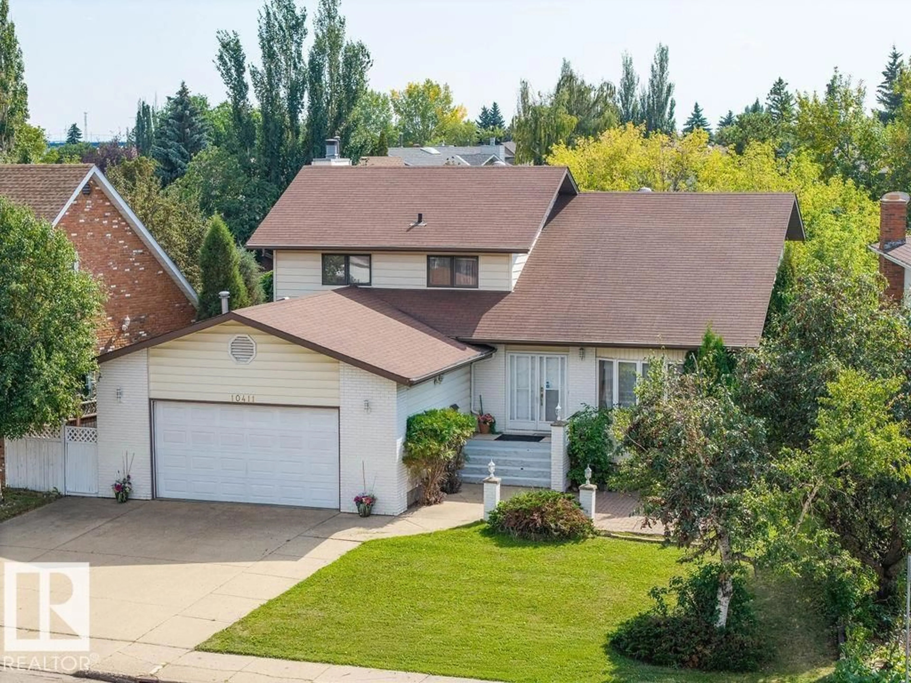 A pic from outside/outdoor area/front of a property/back of a property/a pic from drone, street for 10411 21 AV, Edmonton Alberta T5J5E9