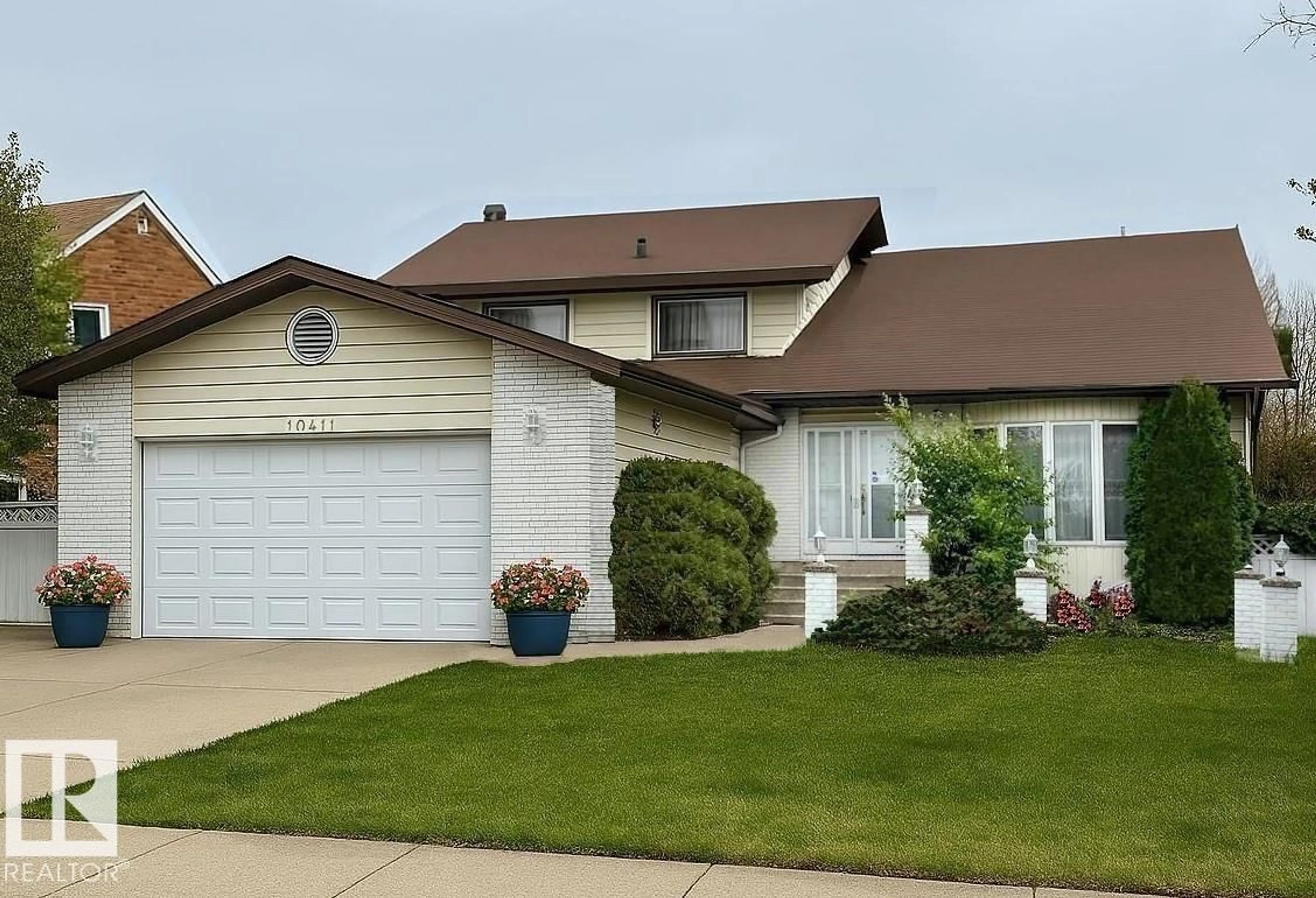 Home with vinyl exterior material, street for 10411 21 AV, Edmonton Alberta T5J5E9