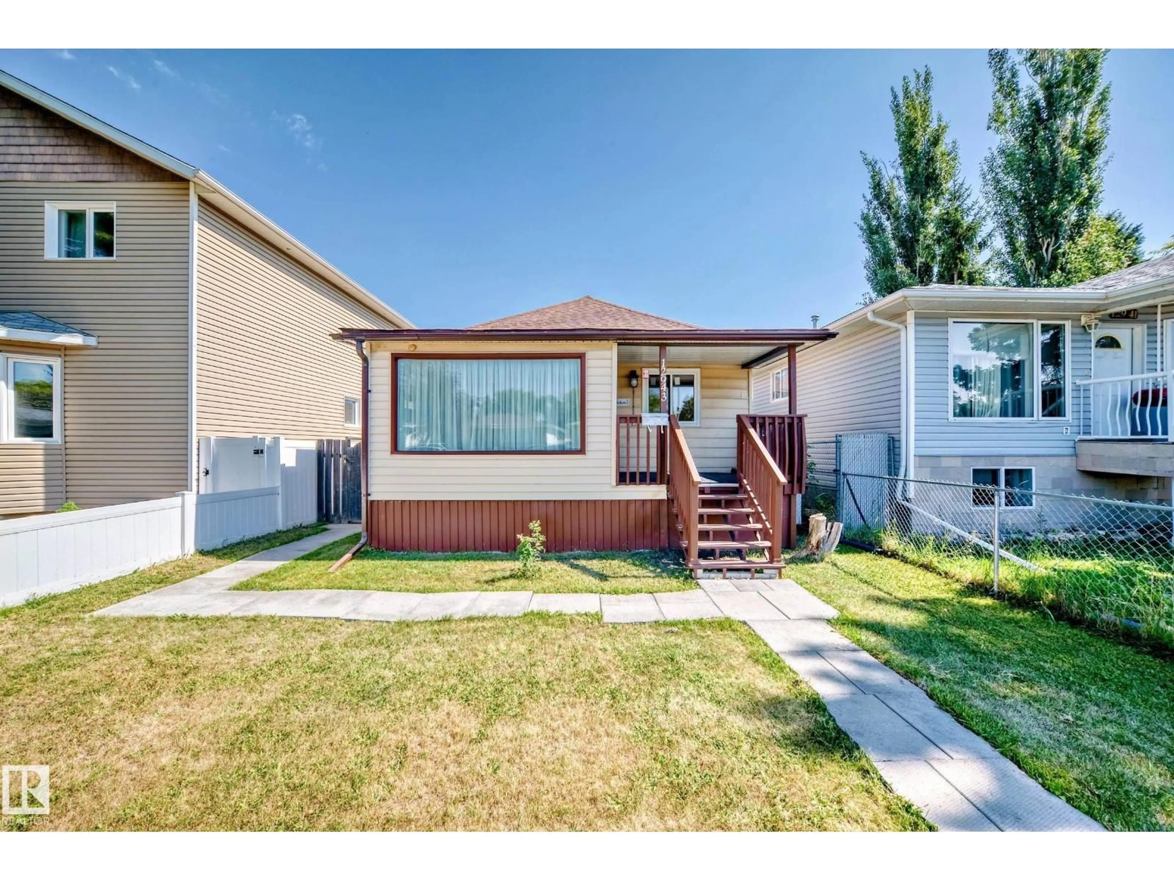 Home with vinyl exterior material, street for NW - 12943 113 ST, Edmonton Alberta T5E5A6