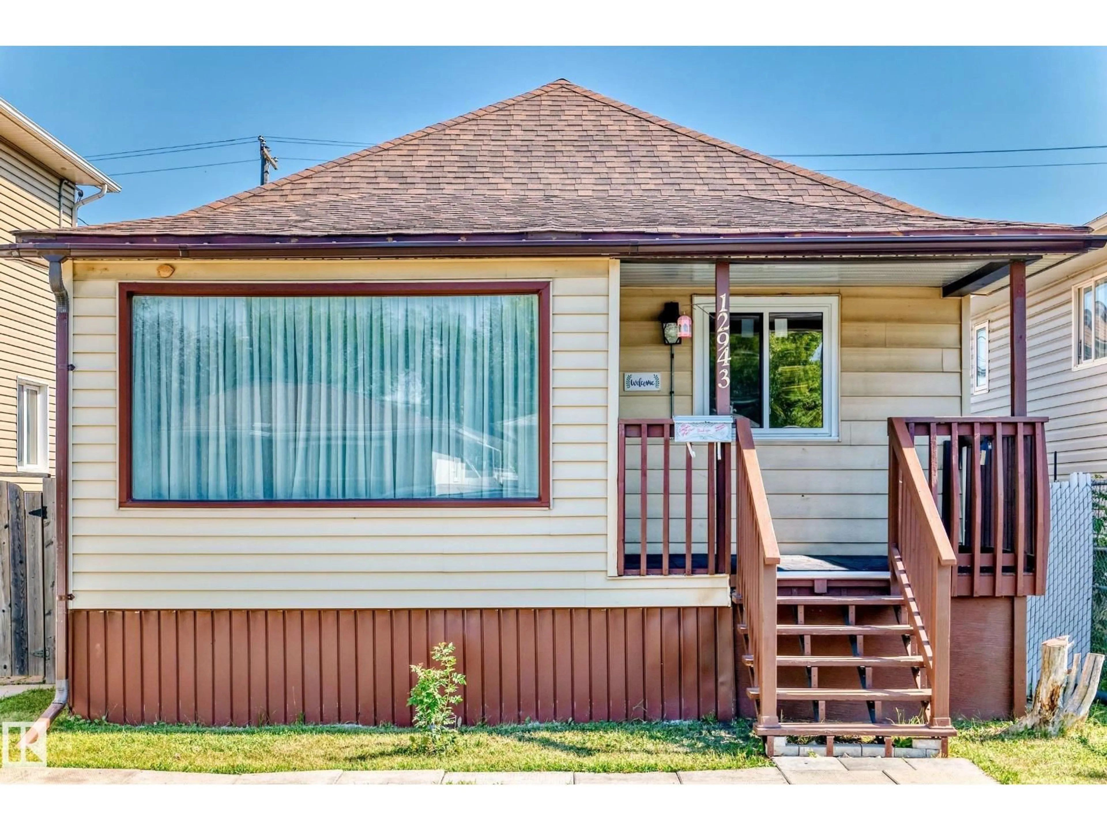 Home with vinyl exterior material, street for NW - 12943 113 ST, Edmonton Alberta T5E5A6