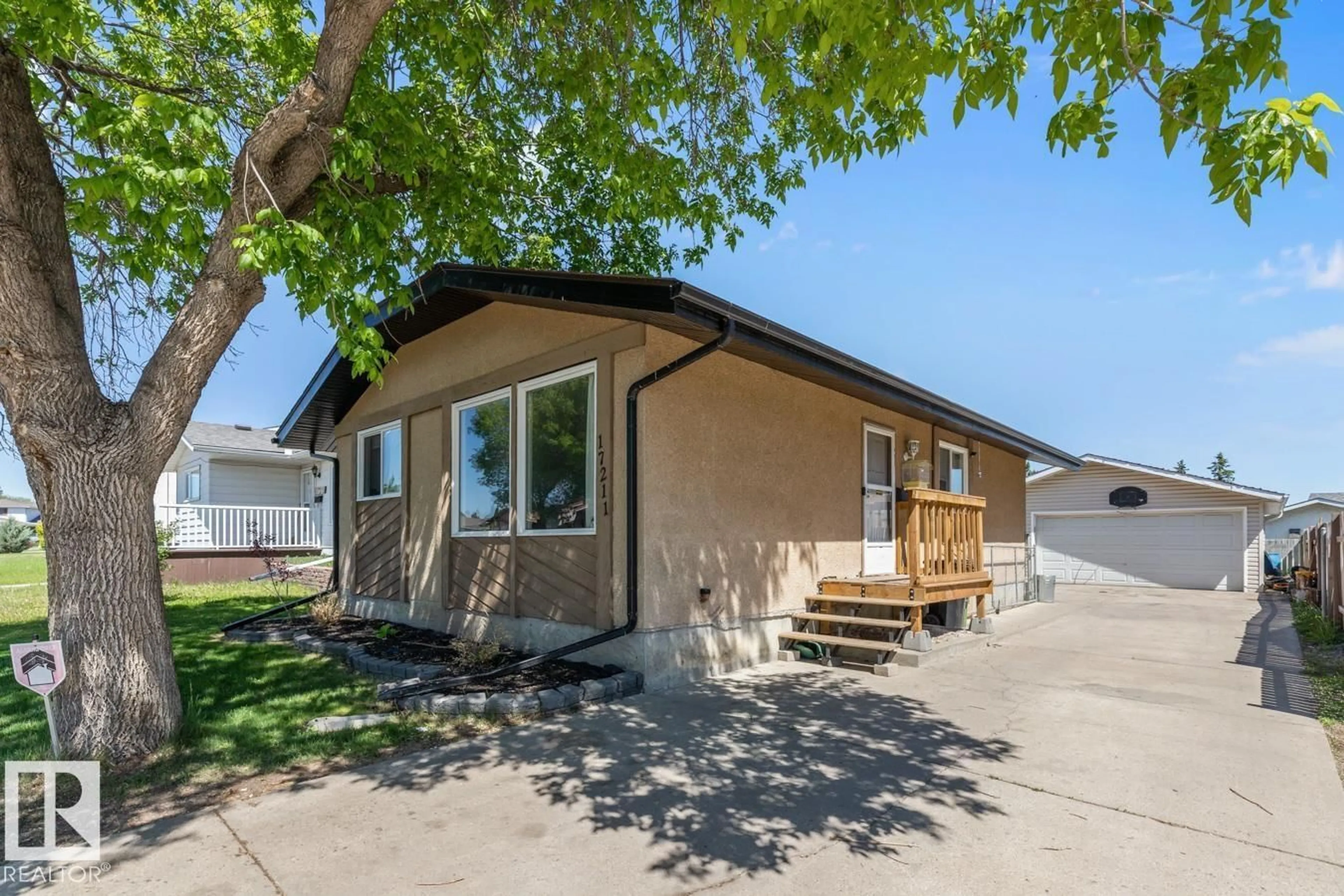 Home with vinyl exterior material, street for NW - 17211 102 ST, Edmonton Alberta T5X3X5