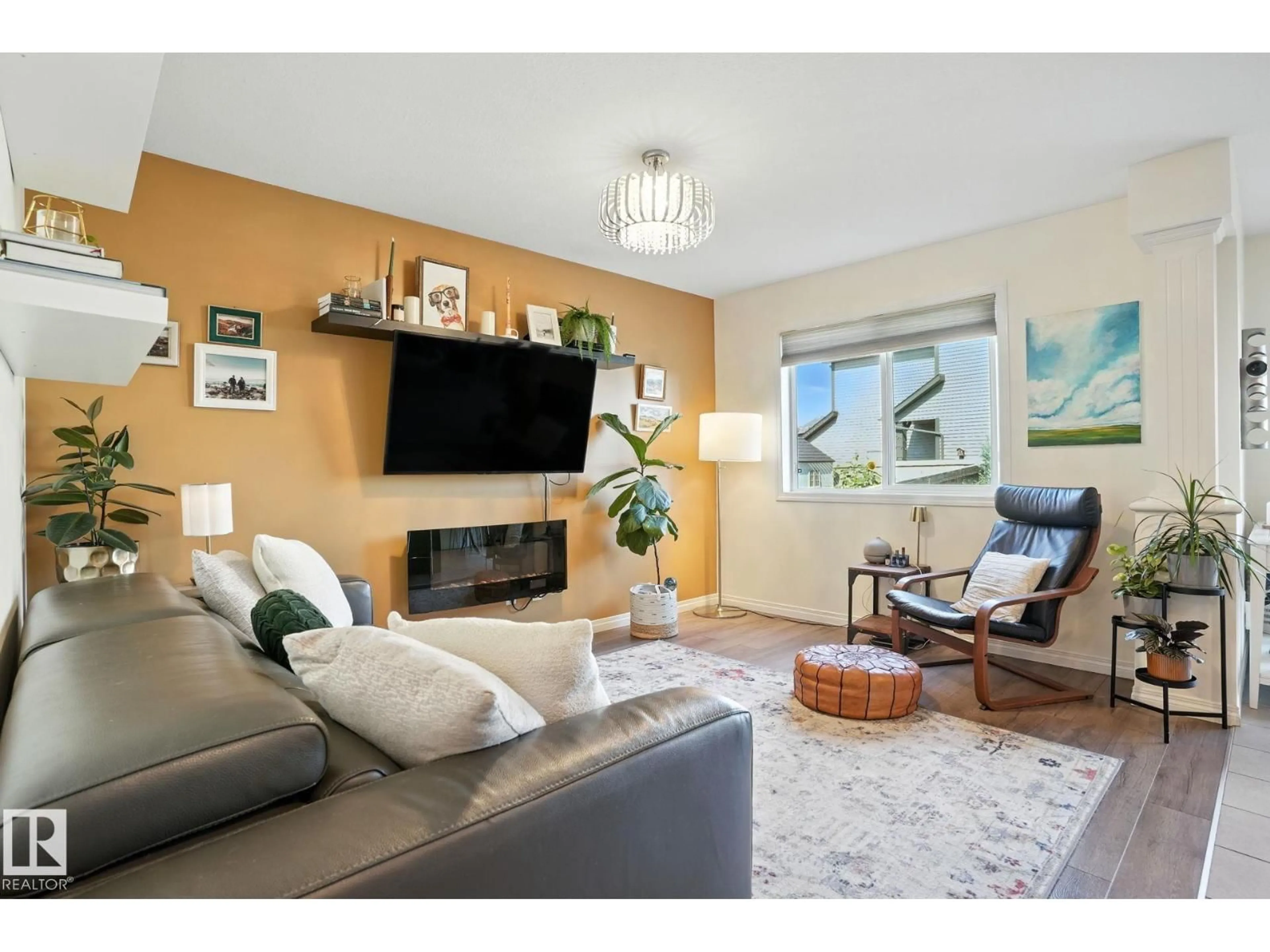 Living room with furniture, wood/laminate floor for 5226 20 AV, Edmonton Alberta T6X1V6