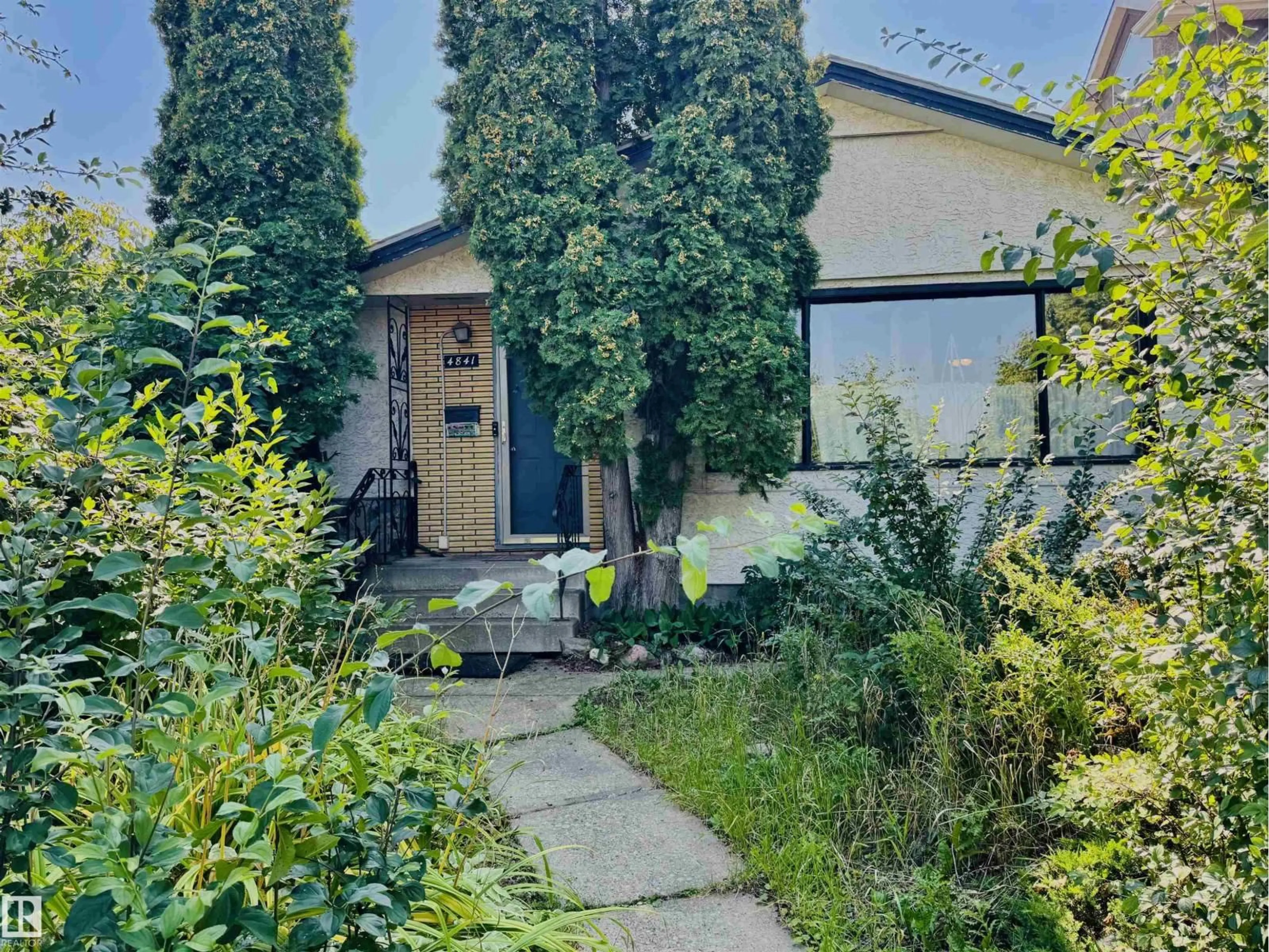 A pic from outside/outdoor area/front of a property/back of a property/a pic from drone, street for 4841 114 AV, Edmonton Alberta T5W0T7