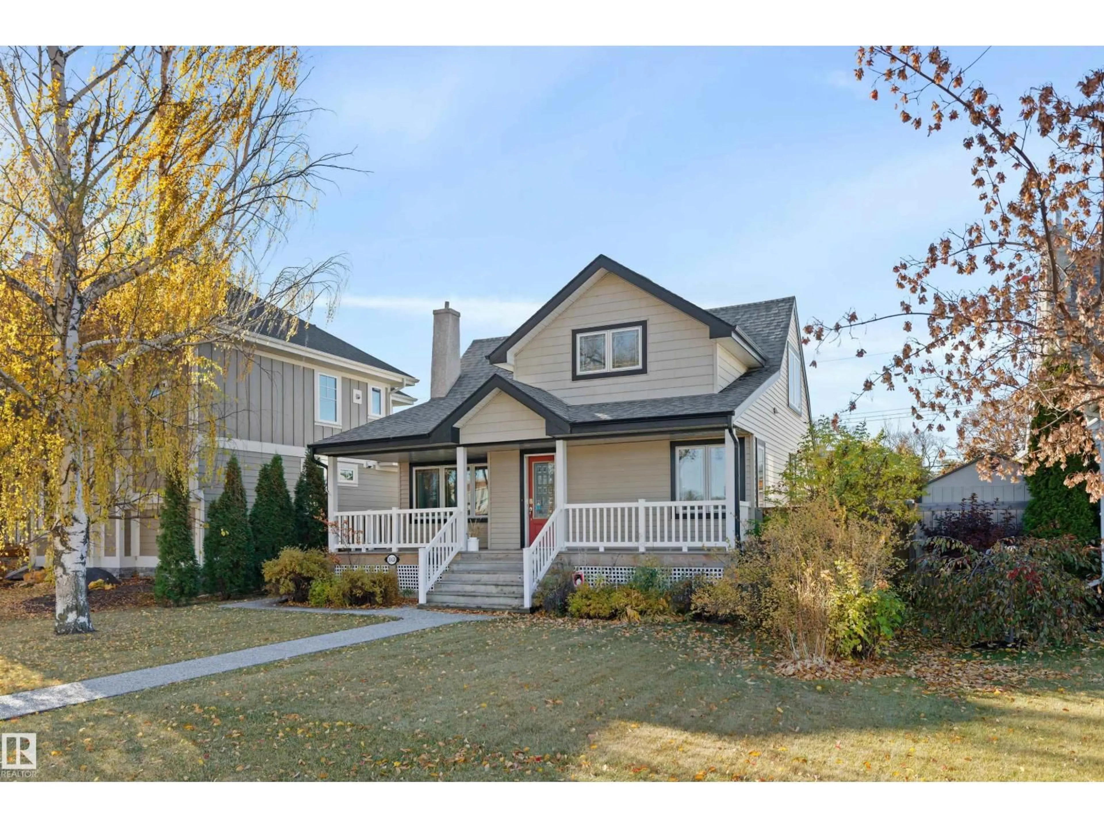 Home with vinyl exterior material, street for NW - 10430 138 ST, Edmonton Alberta T5N2J4