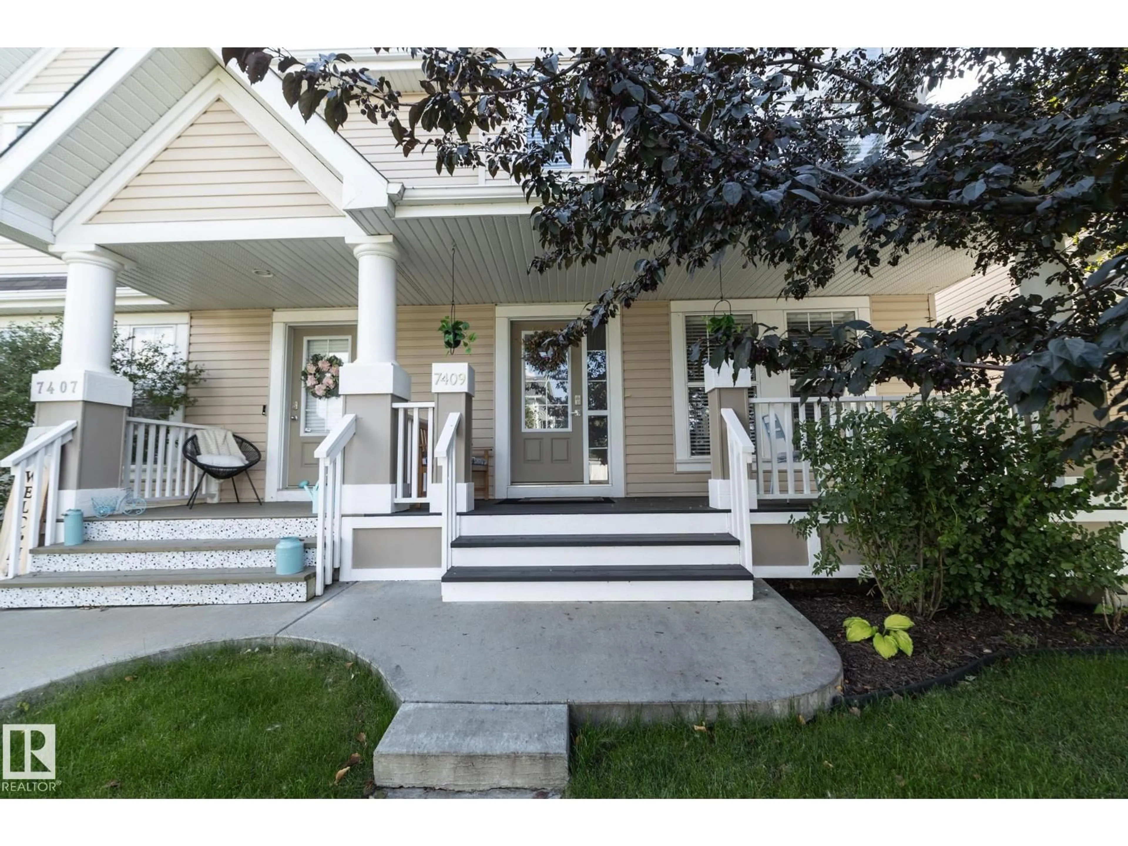 Home with vinyl exterior material, street for 7409 22 AVE, Edmonton Alberta T6X0V6