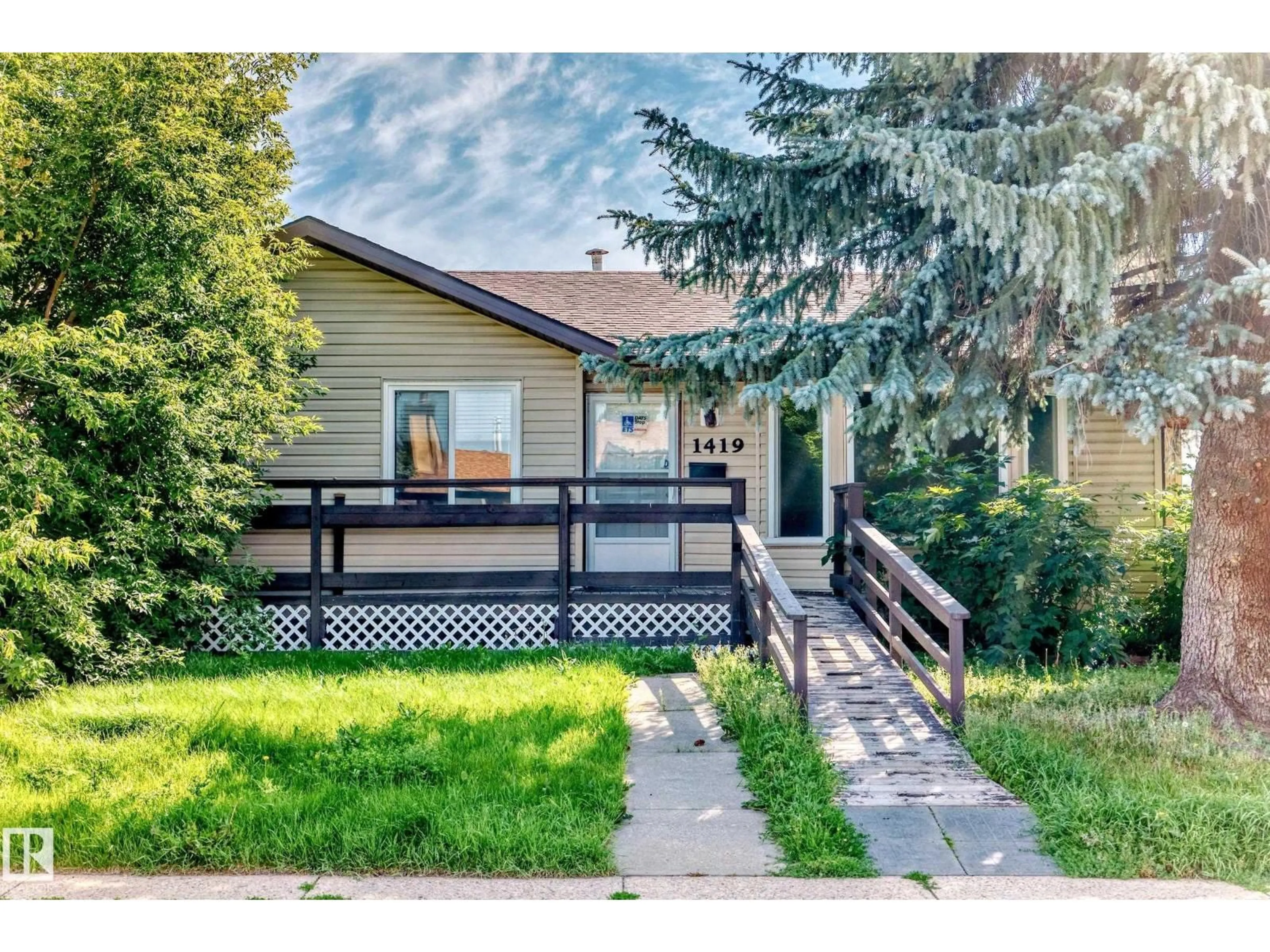 Home with vinyl exterior material, street for 1419 63 ST, Edmonton Alberta T6T1L1