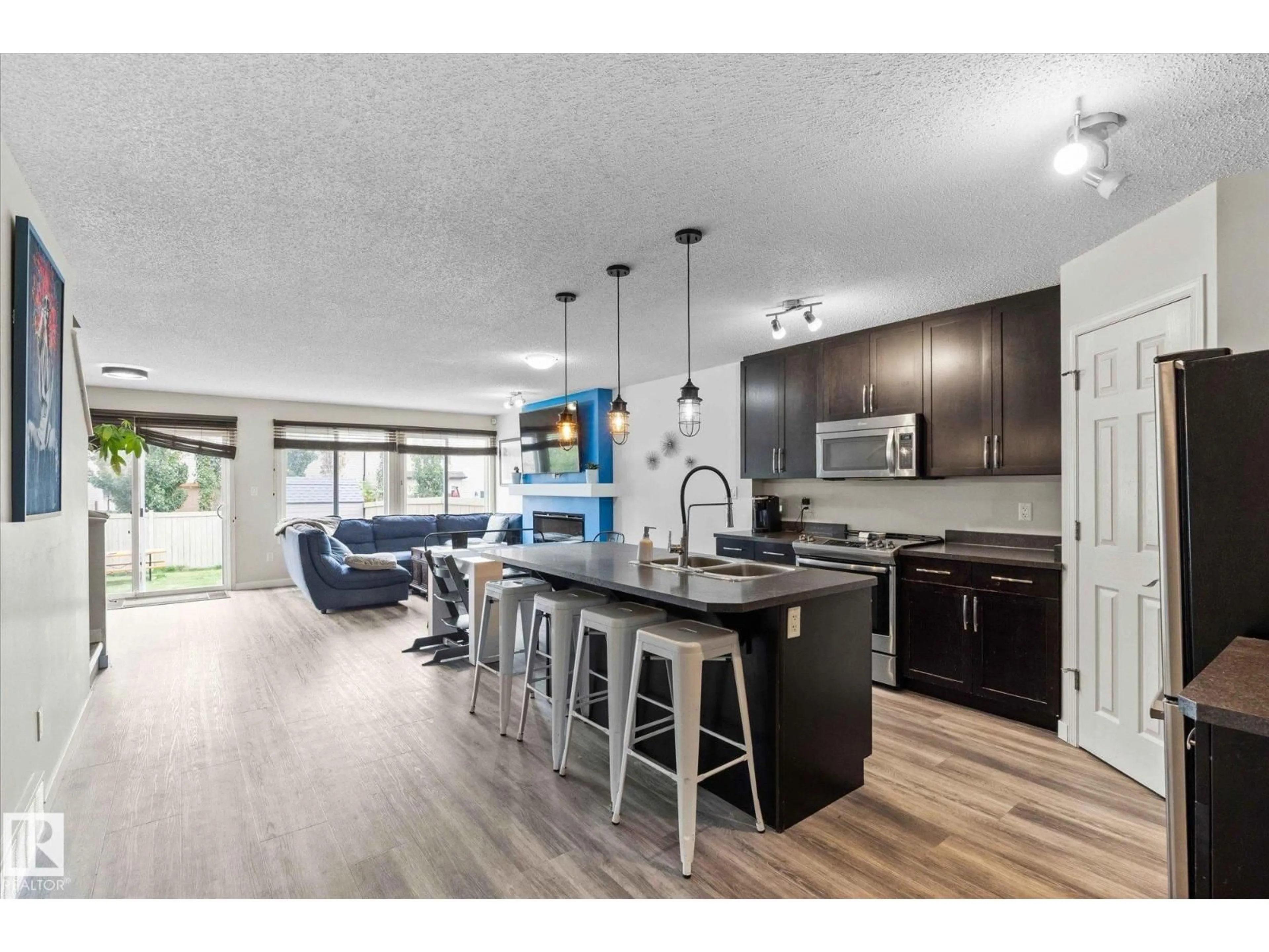 Open concept kitchen, wood/laminate floor for 1641 CHAPMAN WY, Edmonton Alberta T6W0Y5