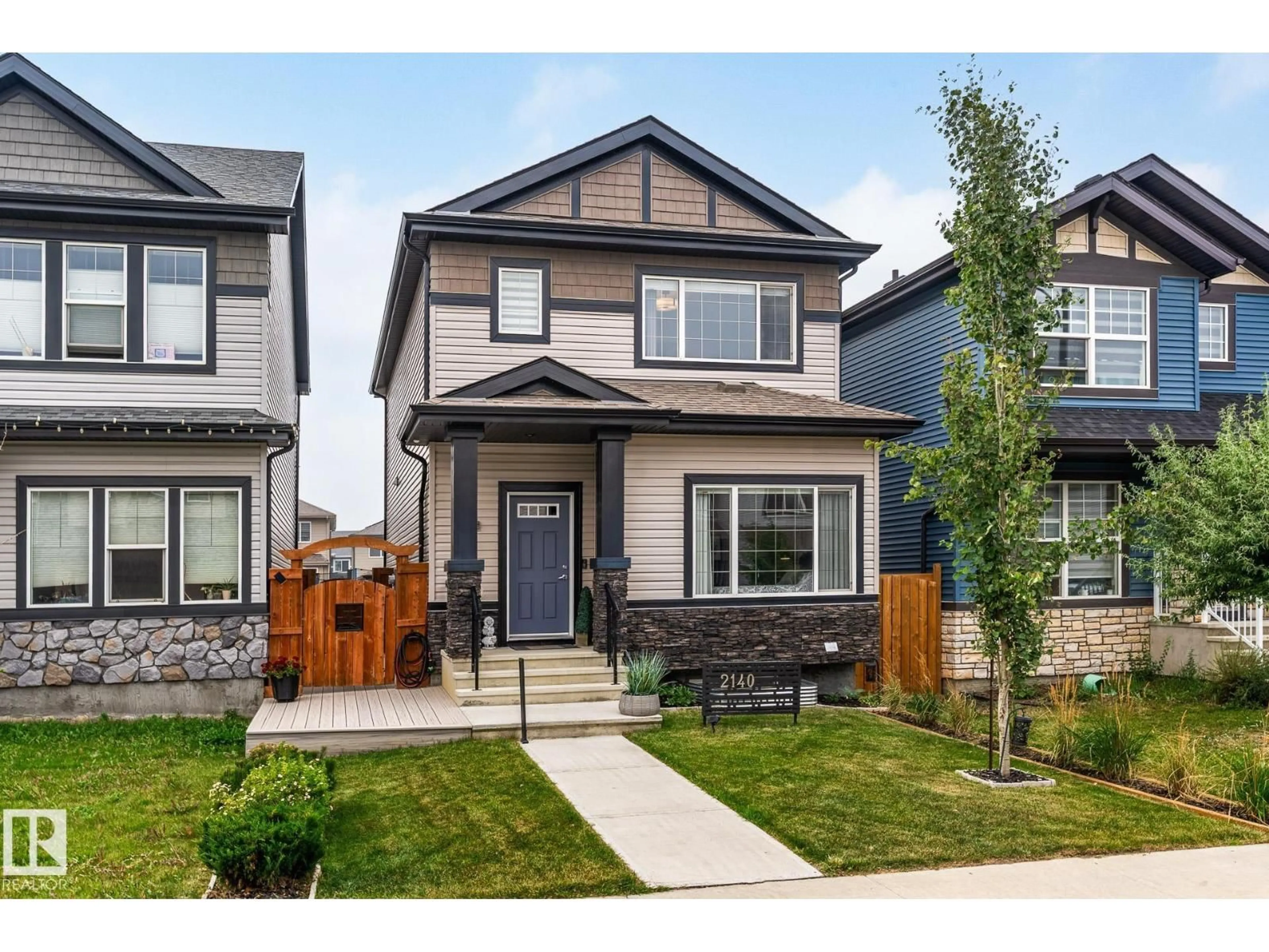 Home with vinyl exterior material, street for 2140 51 ST, Edmonton Alberta T6X2W1