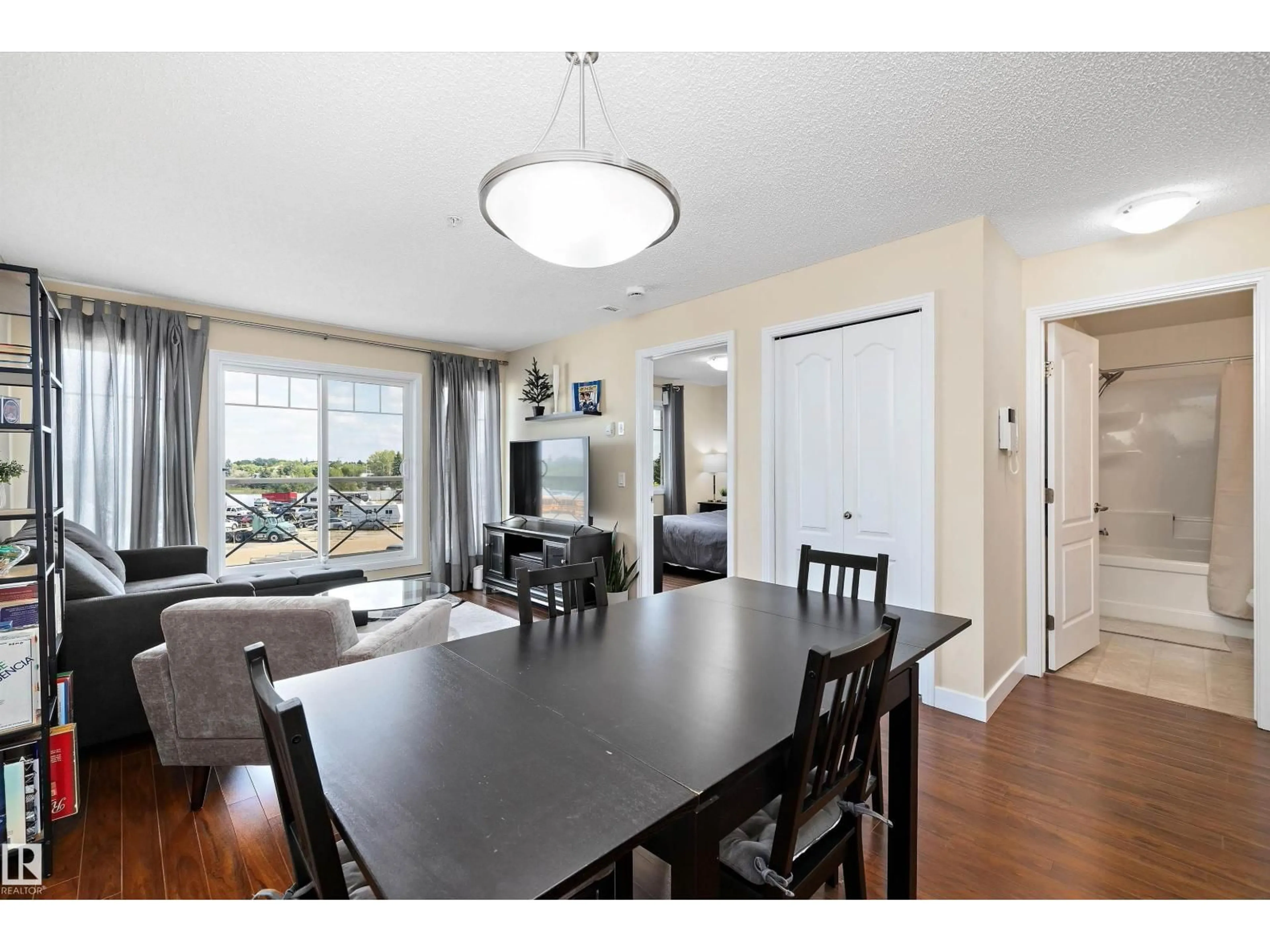 Dining room, wood/laminate floor for #309 - 12650 142 AV, Edmonton Alberta T5X0J4