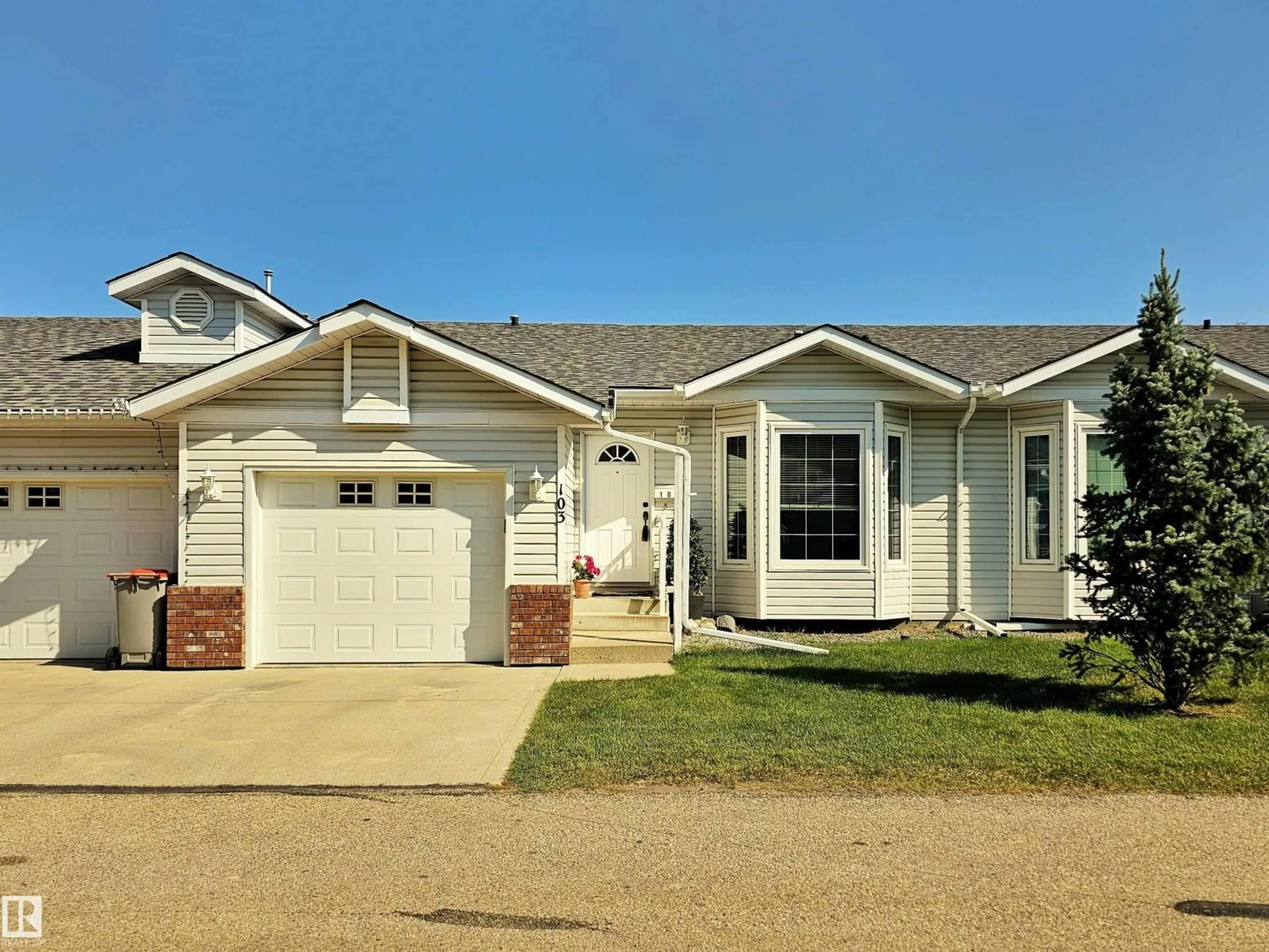 Home with vinyl exterior material, street for 103 - 4408 37 ST, Stony Plain Alberta T7Z1N2