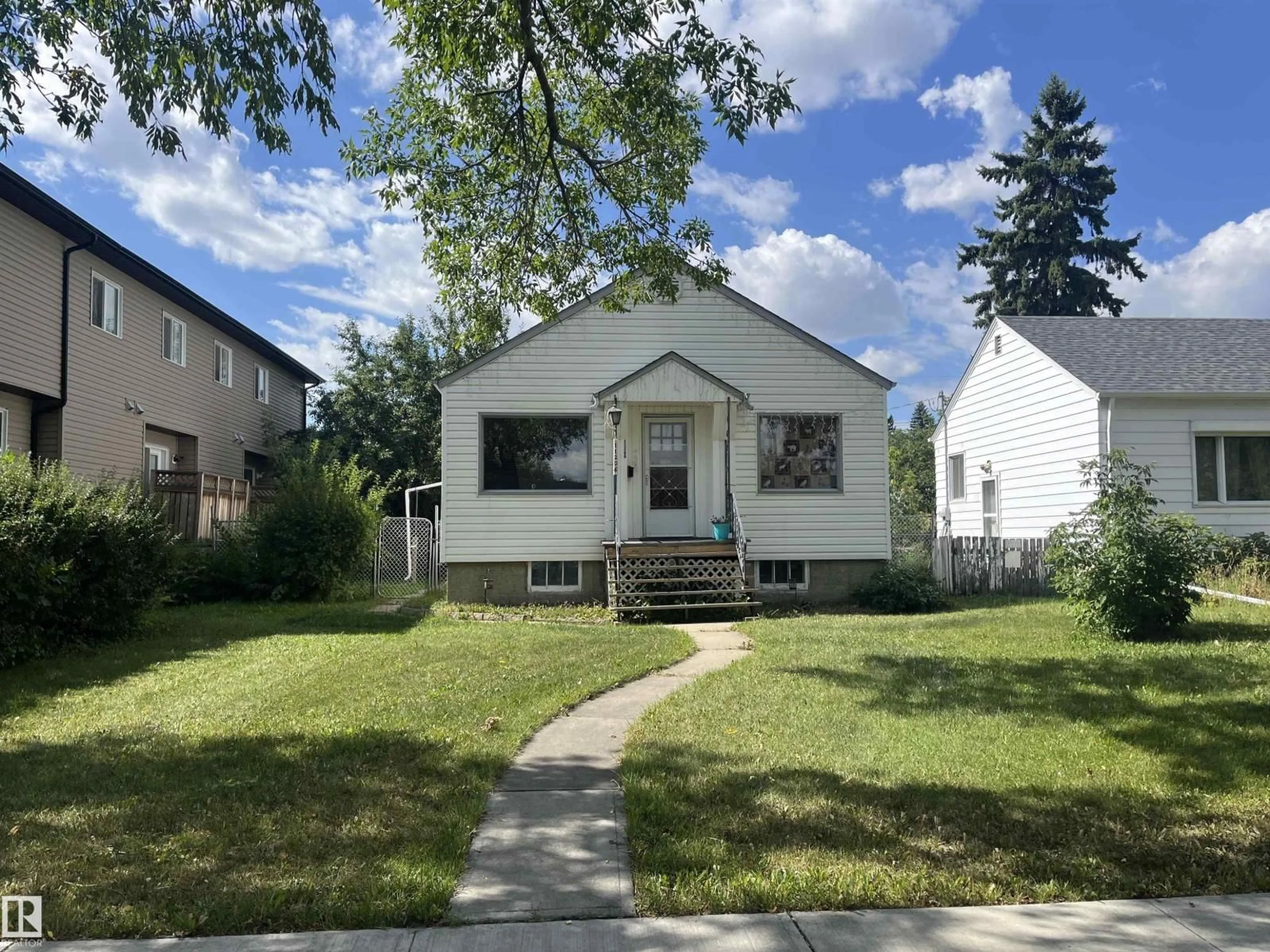 Home with vinyl exterior material, street for NW - 11206 104 ST, Edmonton Alberta T5G2K5