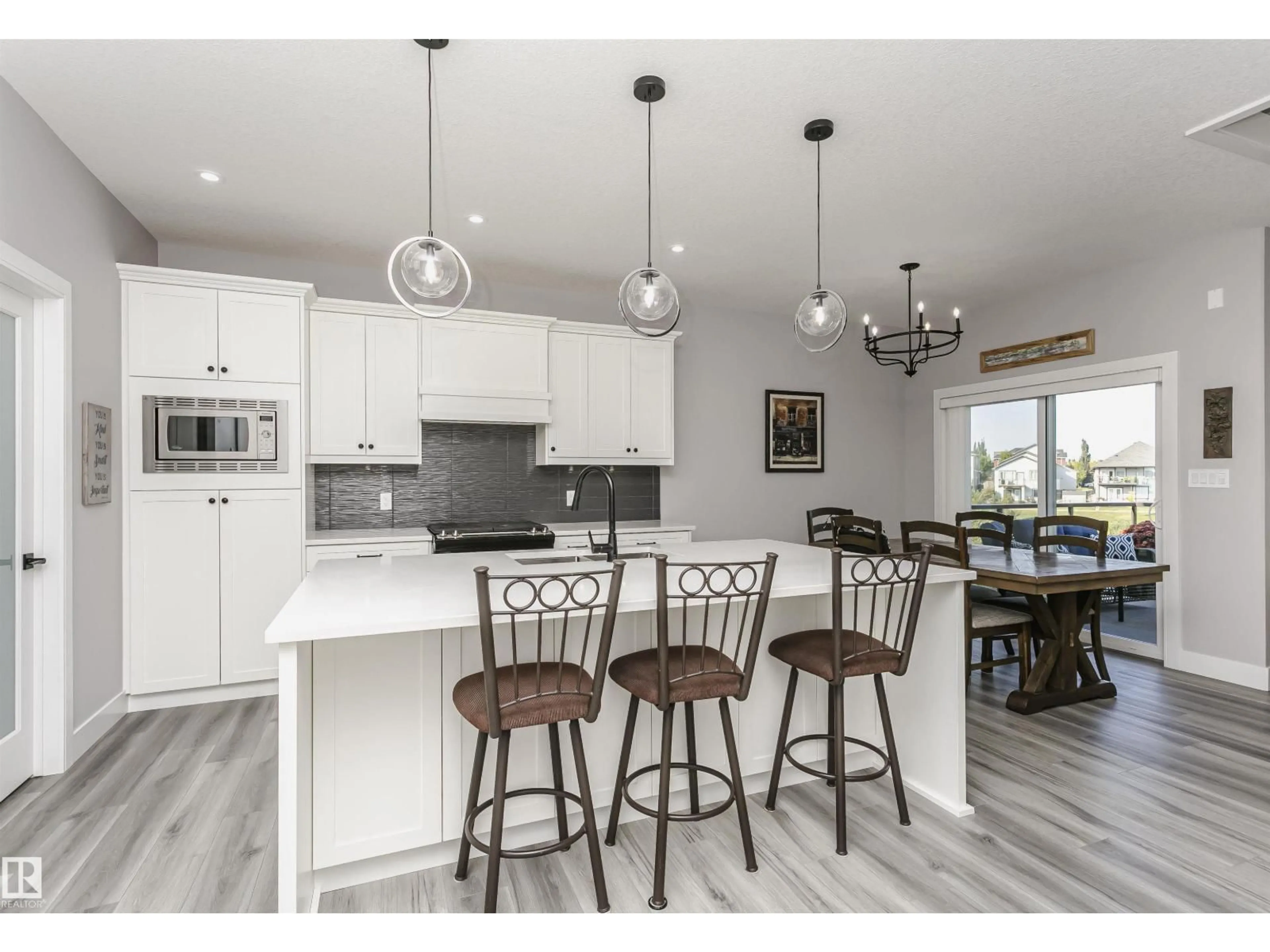 Open concept kitchen, wood/laminate floor for 139 KIDD CR, Leduc Alberta T9E1N6