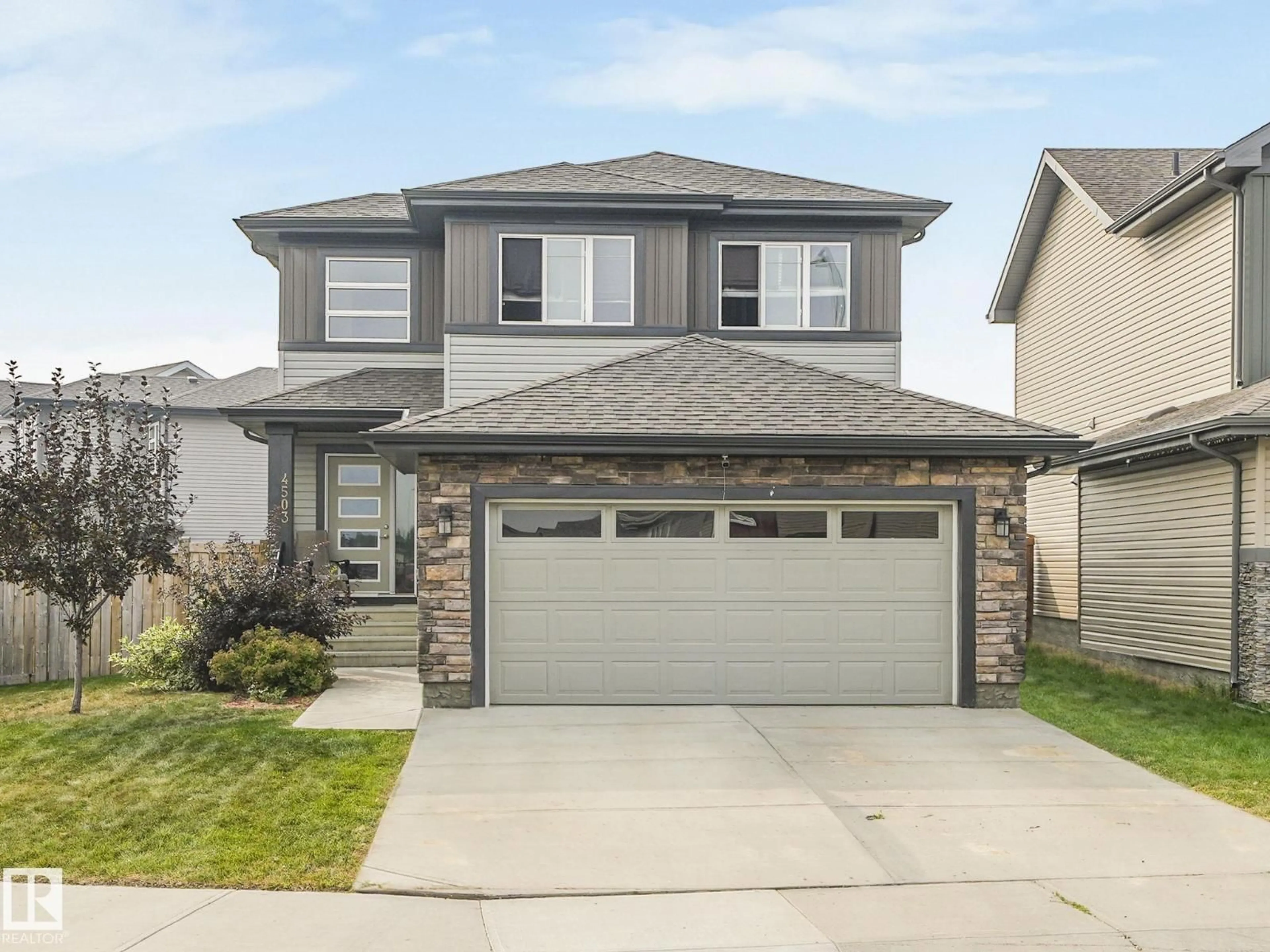 Home with vinyl exterior material, street for 4503 126 AV, Edmonton Alberta T5A4K9