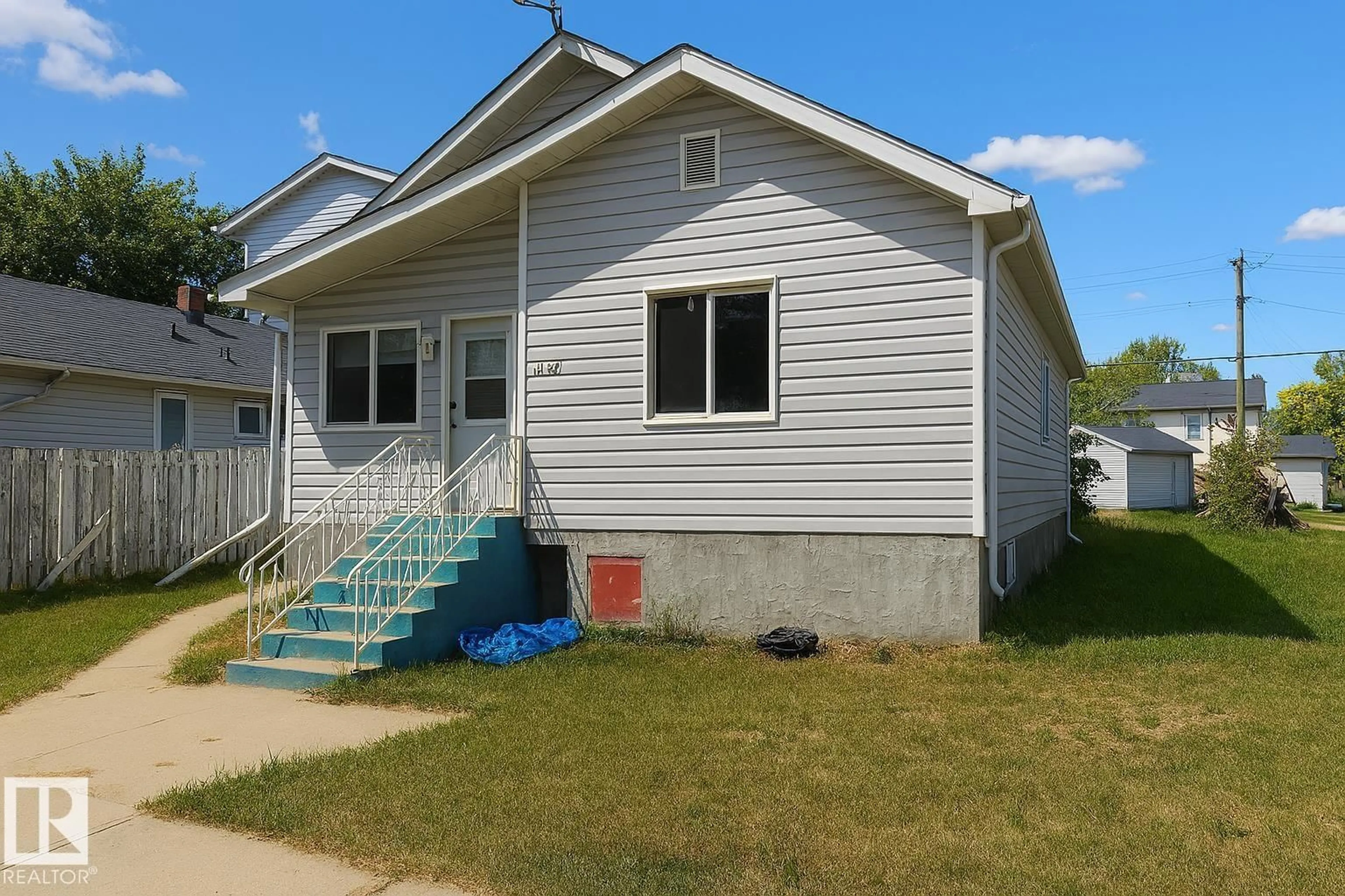 Home with vinyl exterior material, street for NW - 11940 80 ST, Edmonton Alberta T5B2N7