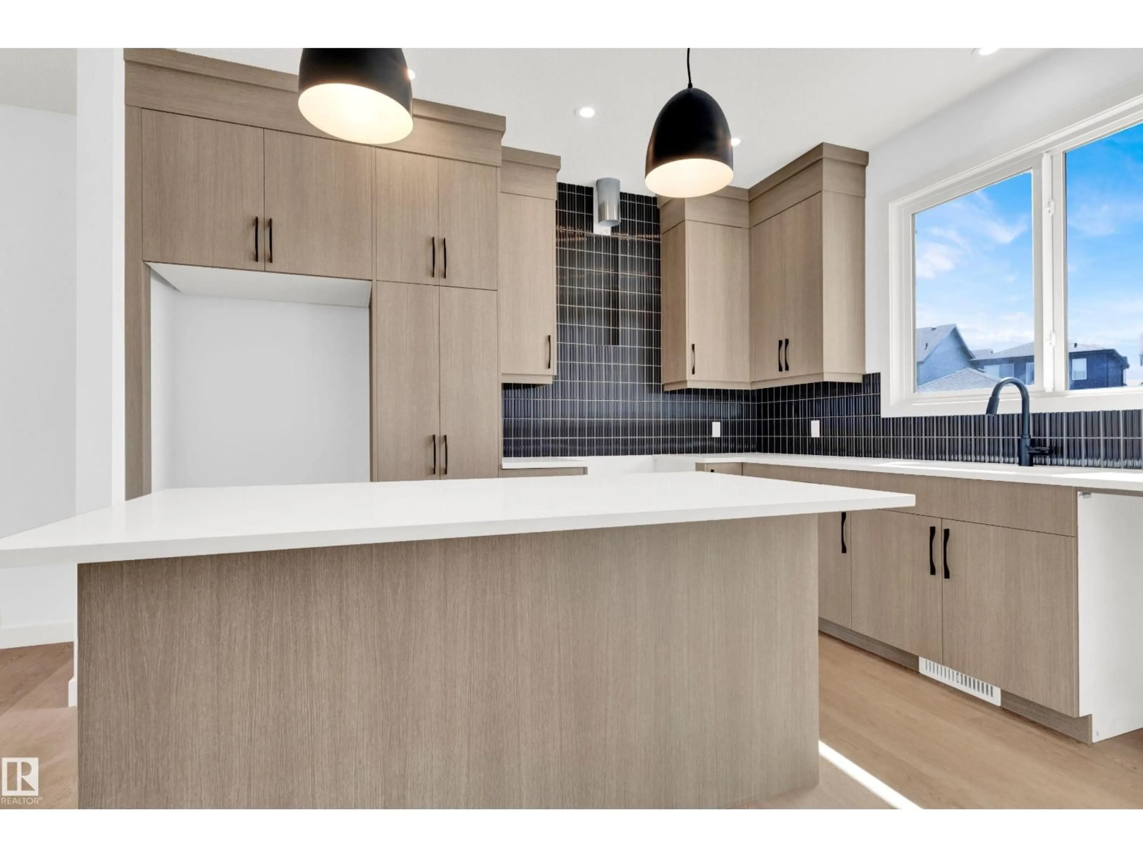 Open concept kitchen, wood/laminate floor for SW - 266 PATERSON LI, Edmonton Alberta T6W5V3