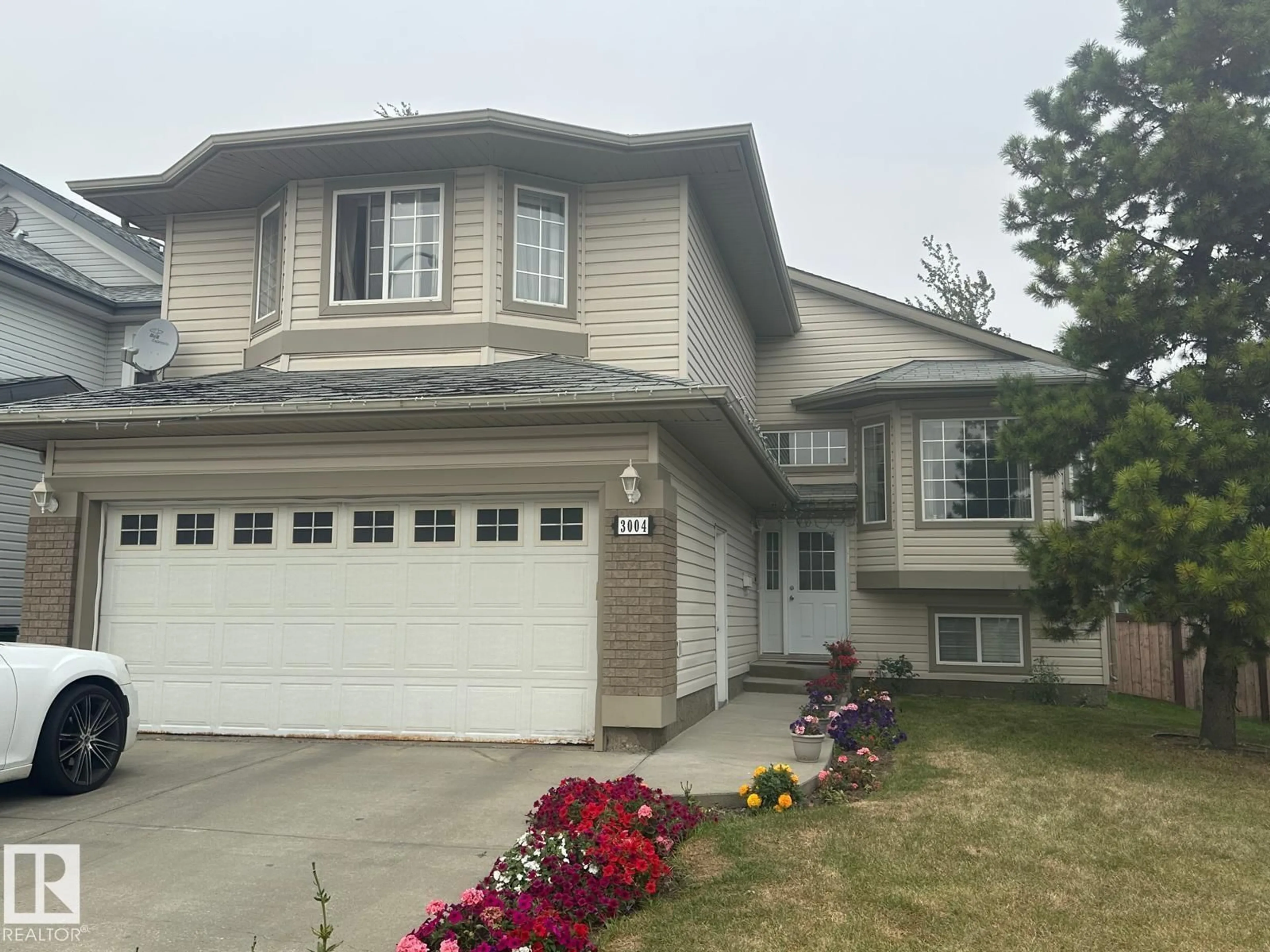 Home with vinyl exterior material, street for NW - 3004 41 AV, Edmonton Alberta T6T1K5