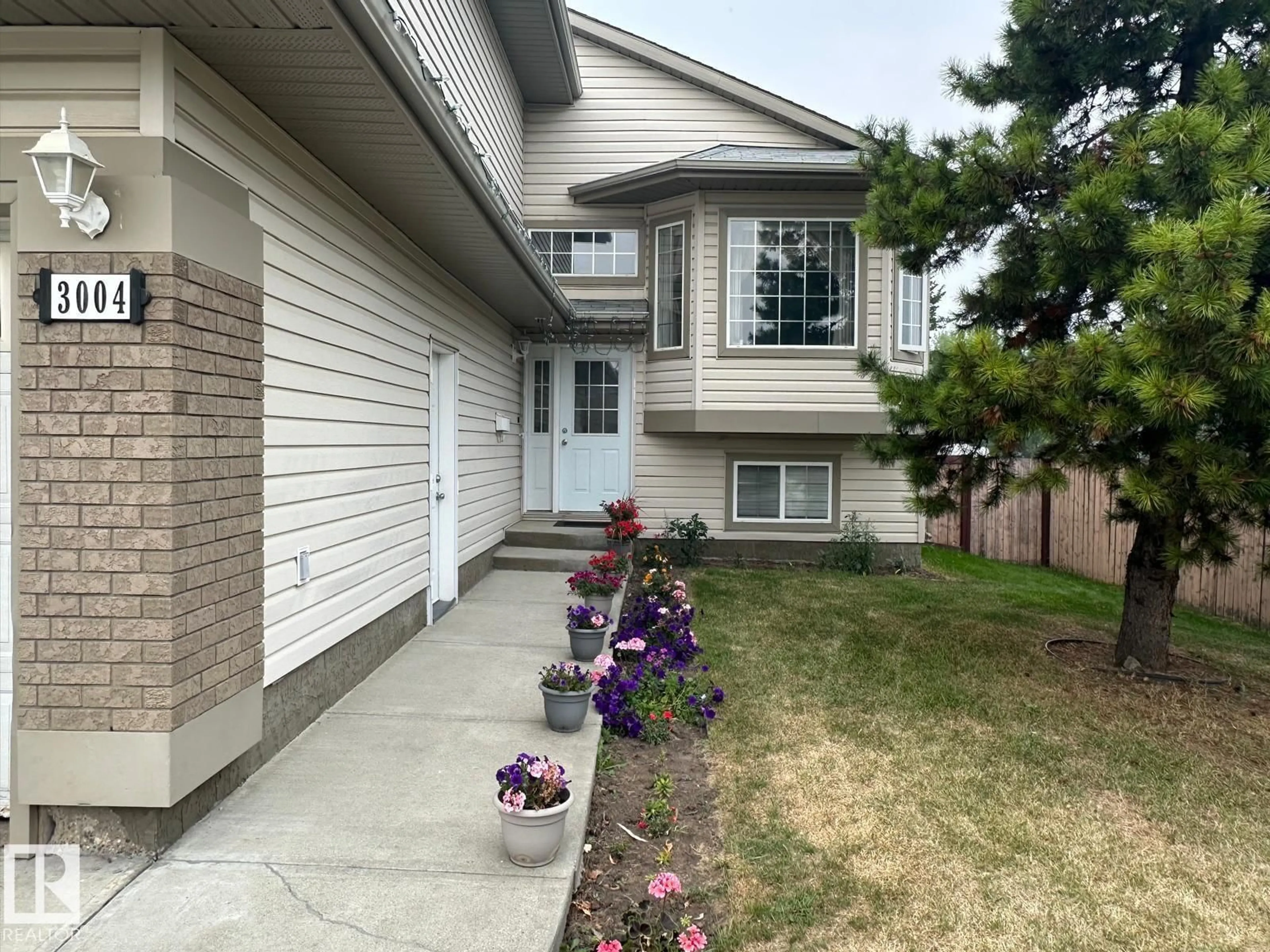Home with vinyl exterior material, street for NW - 3004 41 AV, Edmonton Alberta T6T1K5