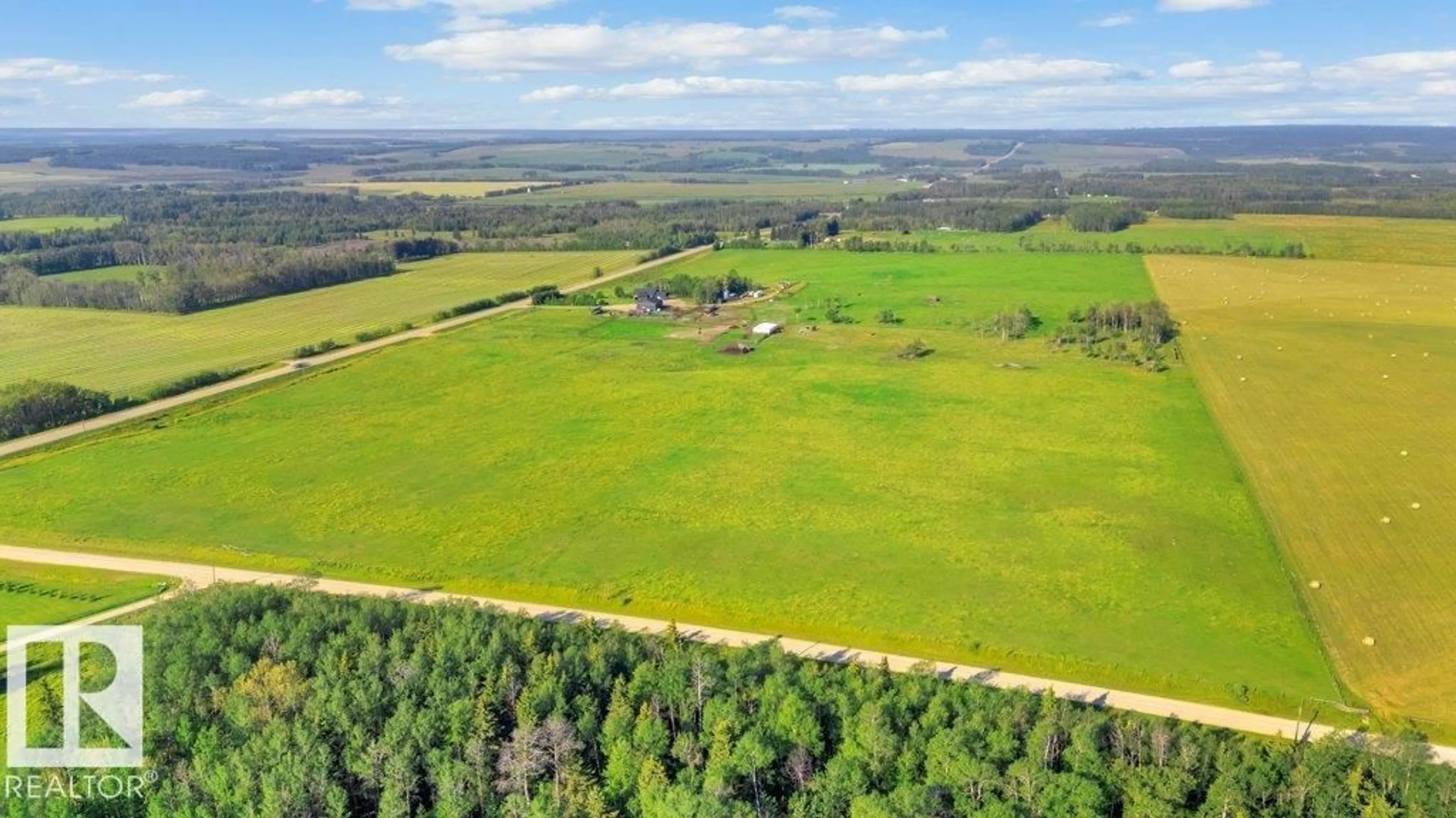 A pic from outside/outdoor area/front of a property/back of a property/a pic from drone, forest/trees view for 32022 HWY 611, Rural Ponoka County Alberta T0C0M0