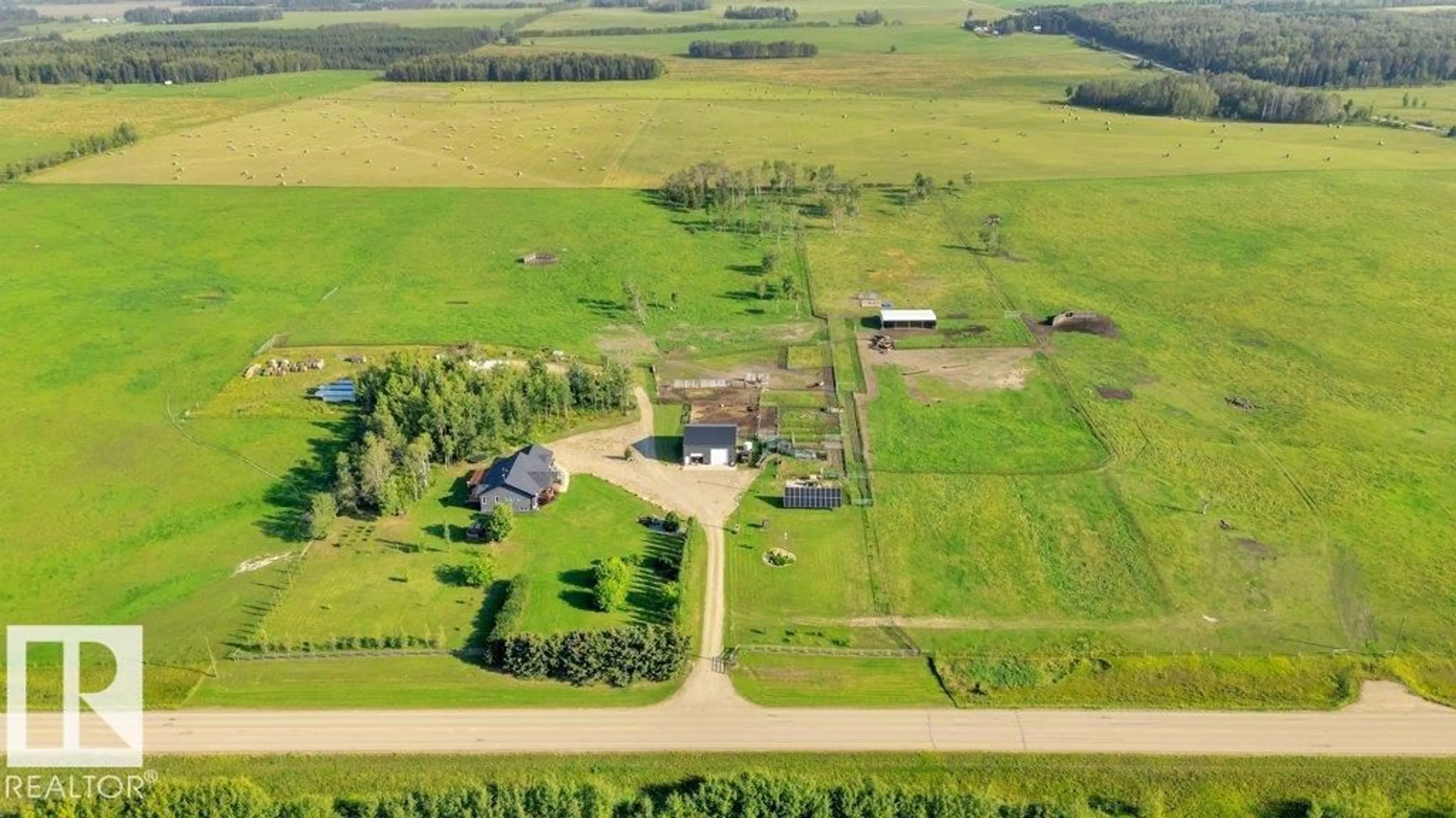 A pic from outside/outdoor area/front of a property/back of a property/a pic from drone, building for 32022 HWY 611, Rural Ponoka County Alberta T0C0M0