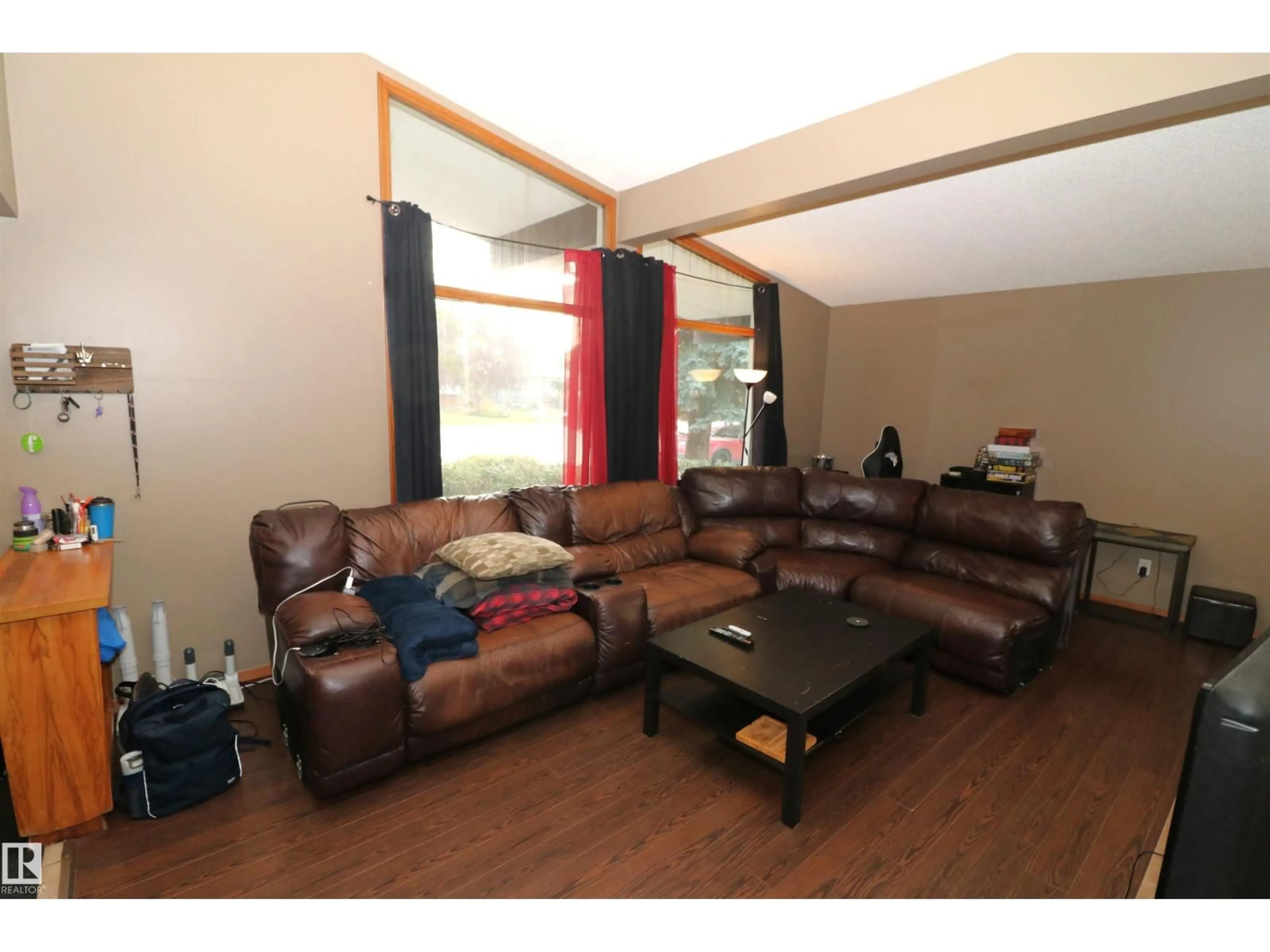 Living room with furniture, wood/laminate floor for 11716 42 AV, Edmonton Alberta T6M1A7