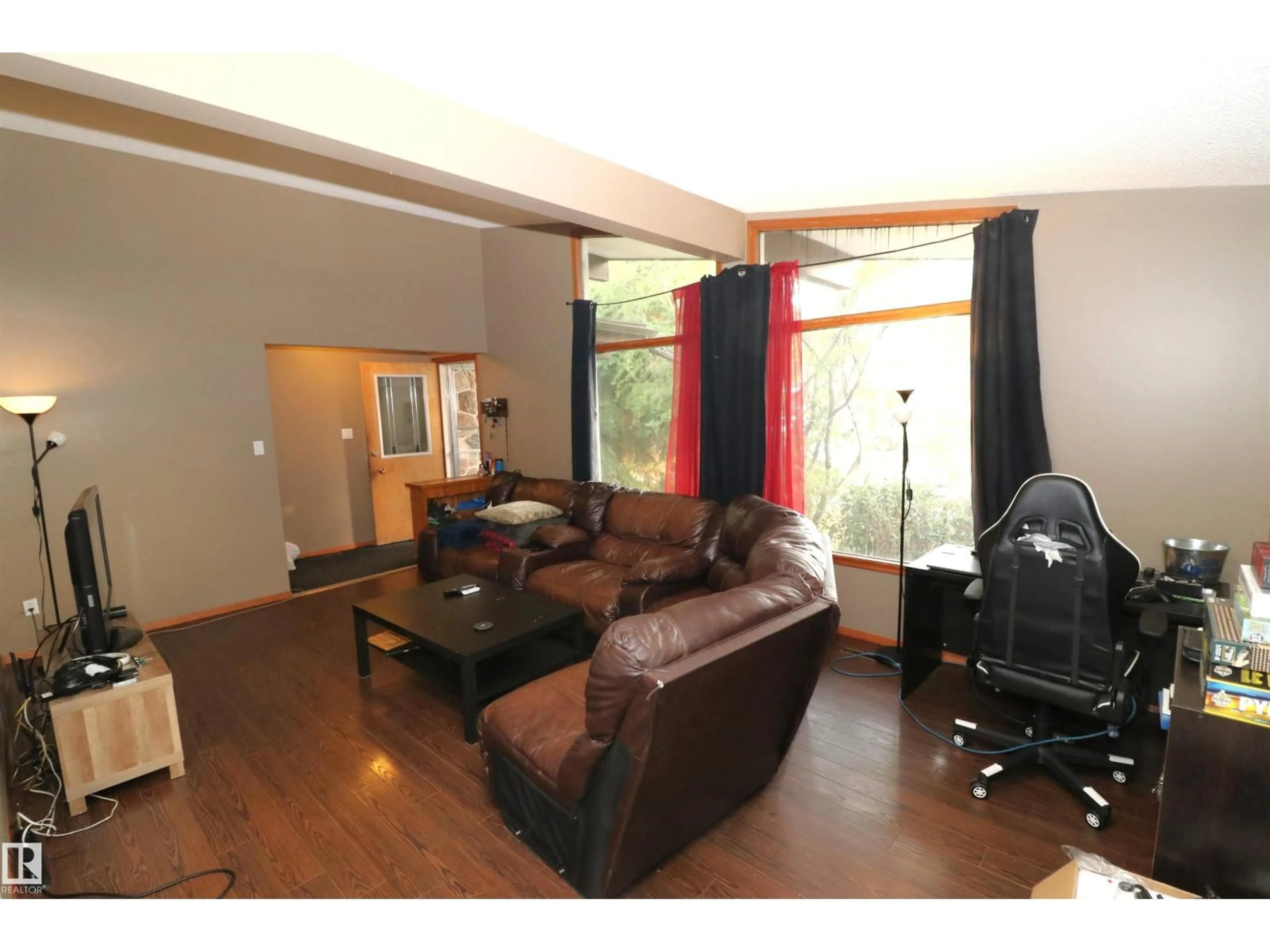 Living room with furniture, wood/laminate floor for 11716 42 AV, Edmonton Alberta T6M1A7